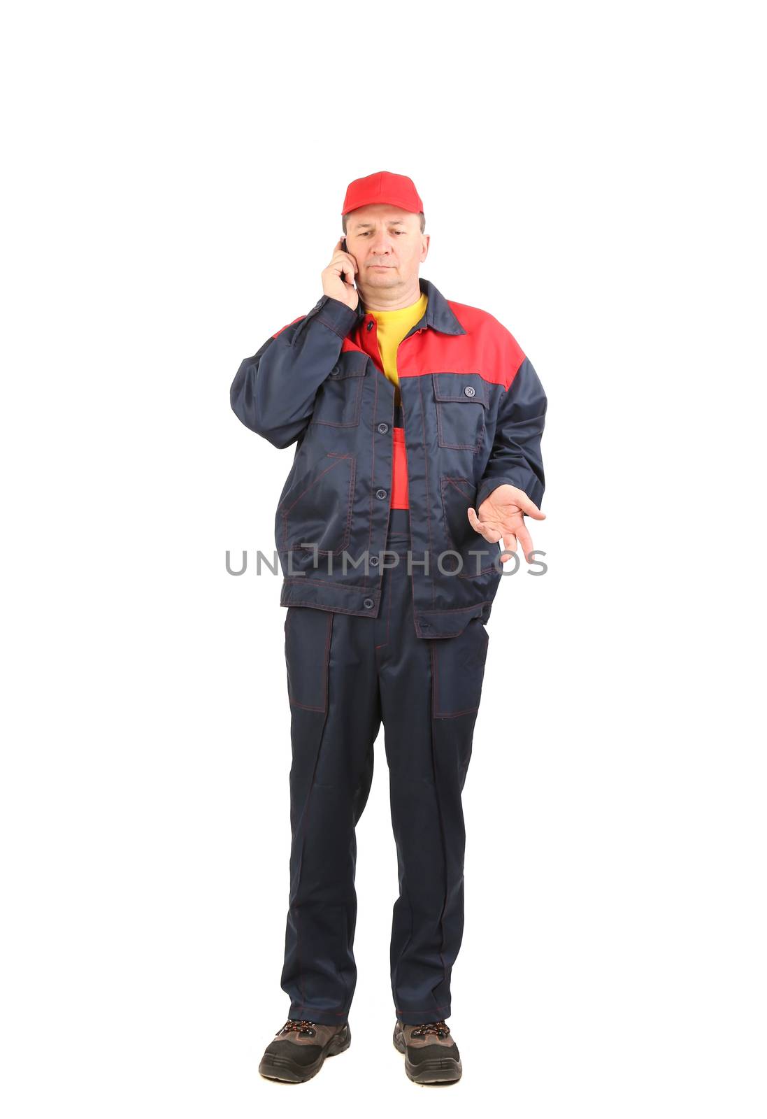 Worker talking on the cell phone. Isolated on a white background.