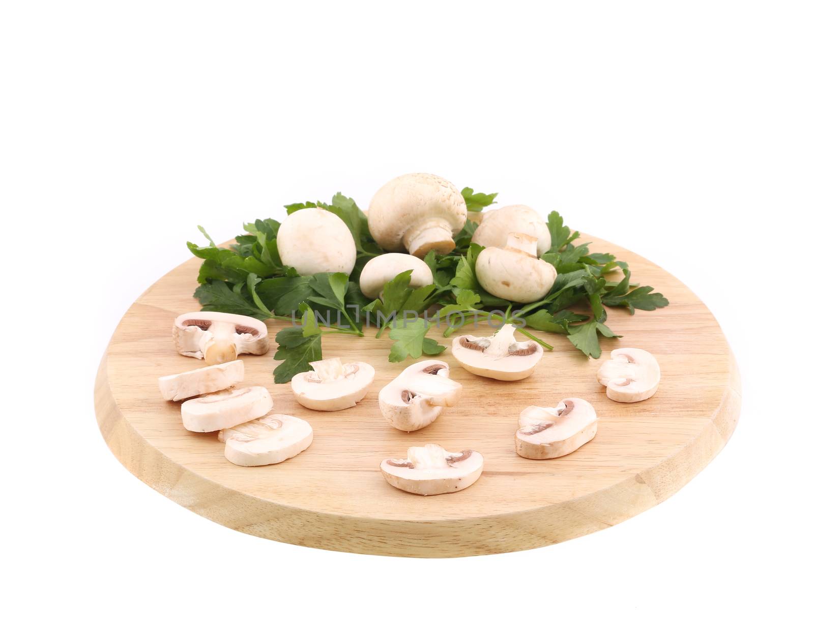 Mushrooms champignon on platter. Isolated on a white background.