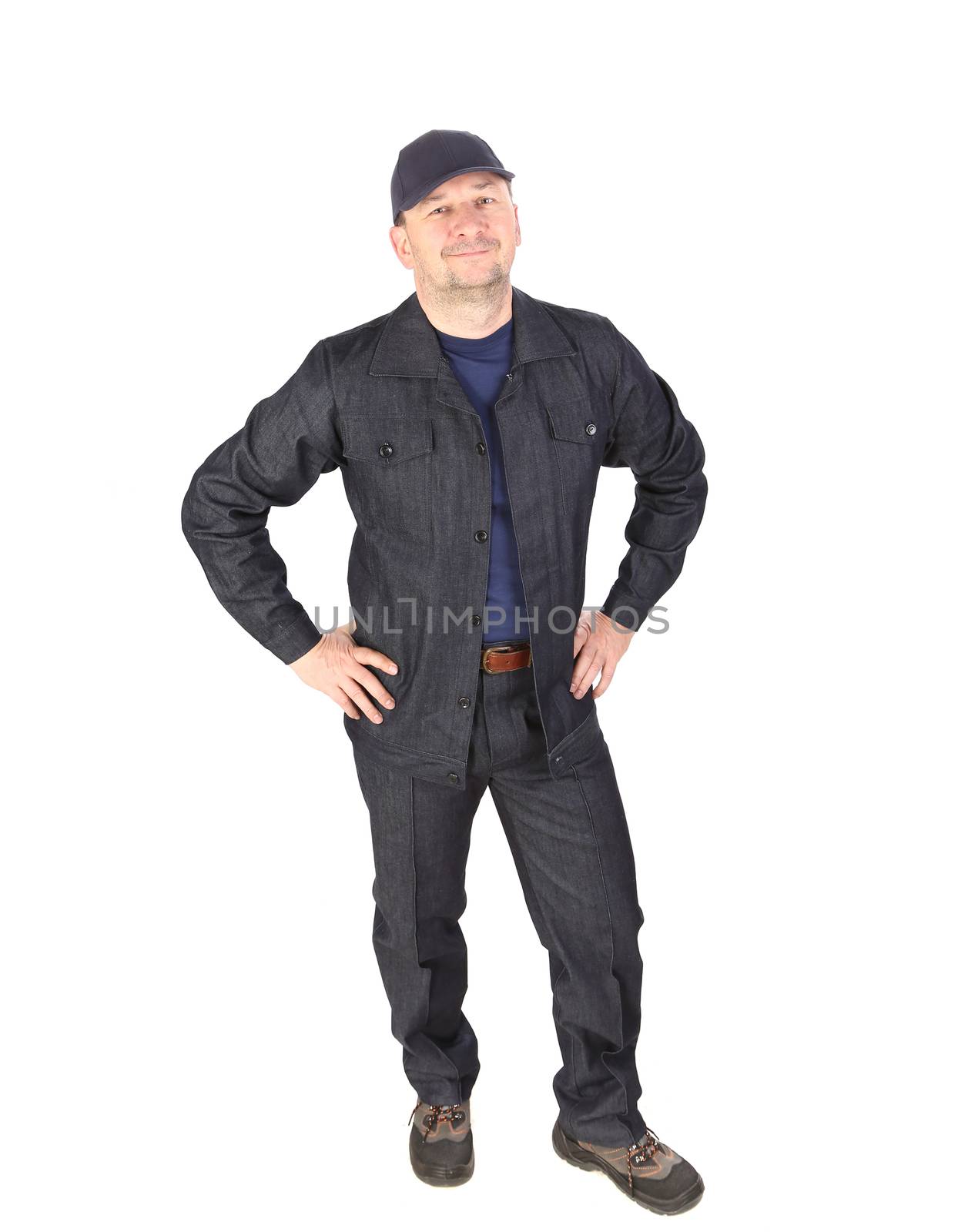 Worker in cap with hands on hips. Isolated on a white background.