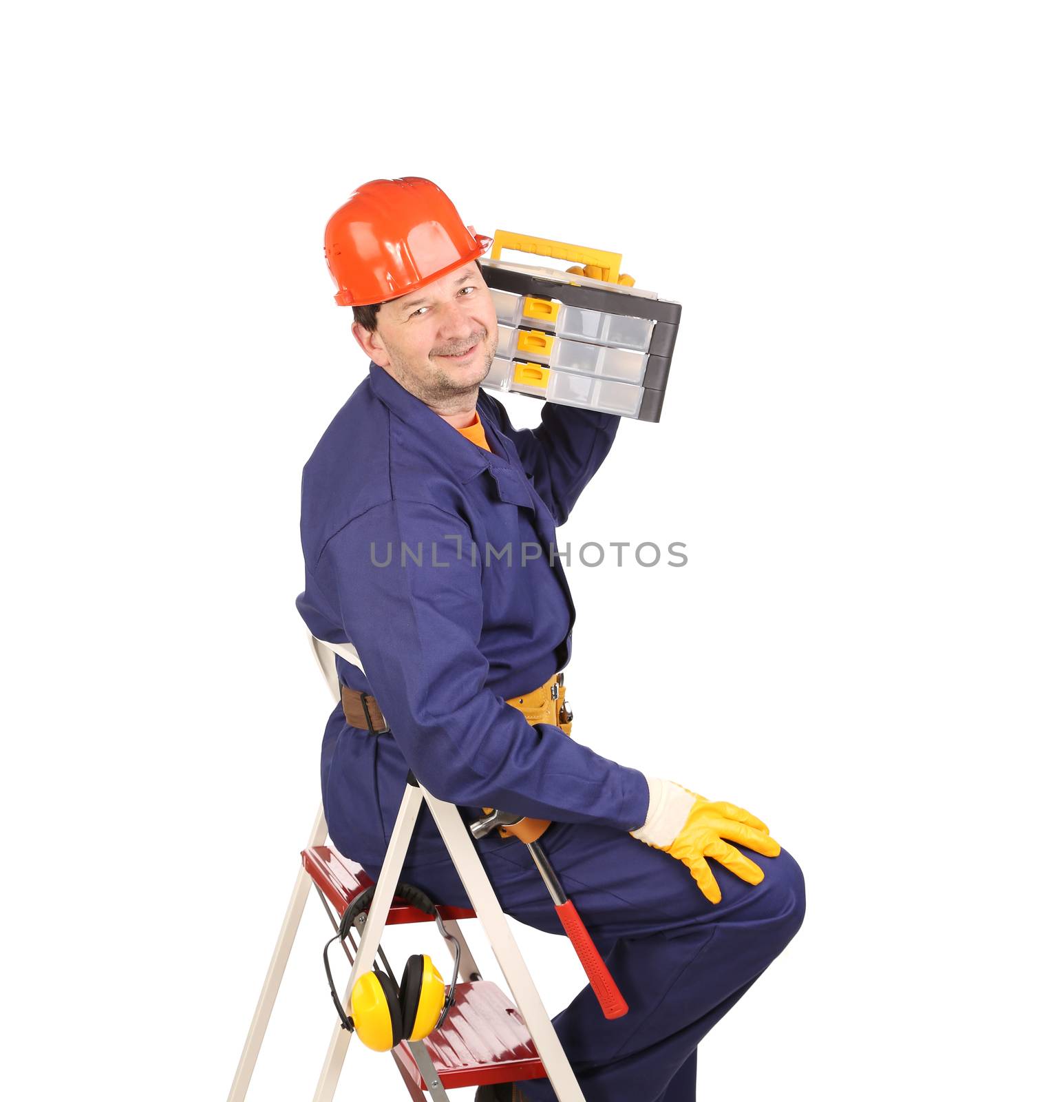 Worker on ladder holding toolbox. by indigolotos