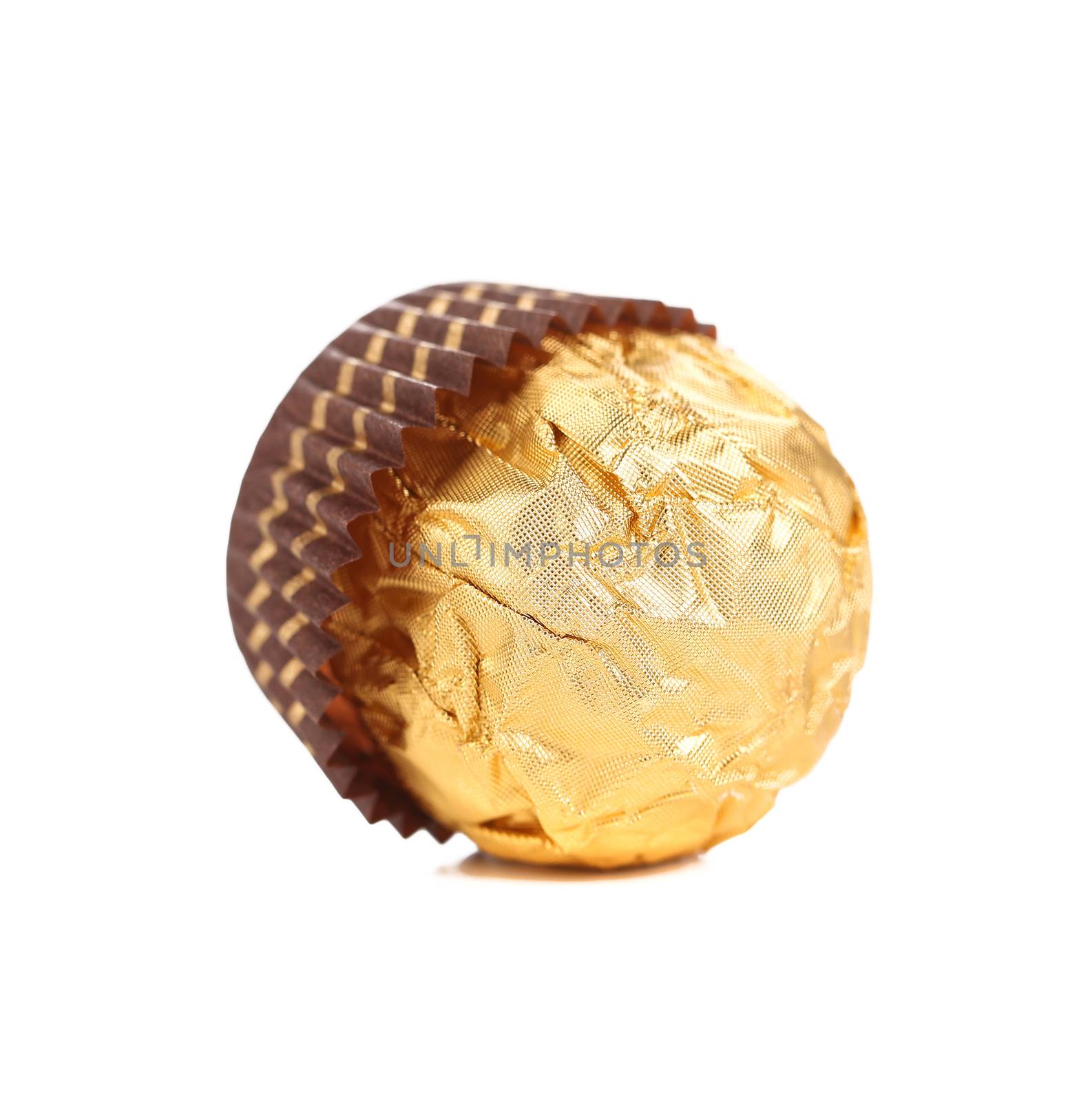 Delicious gold foiled bonbon. Isolated on a white background.