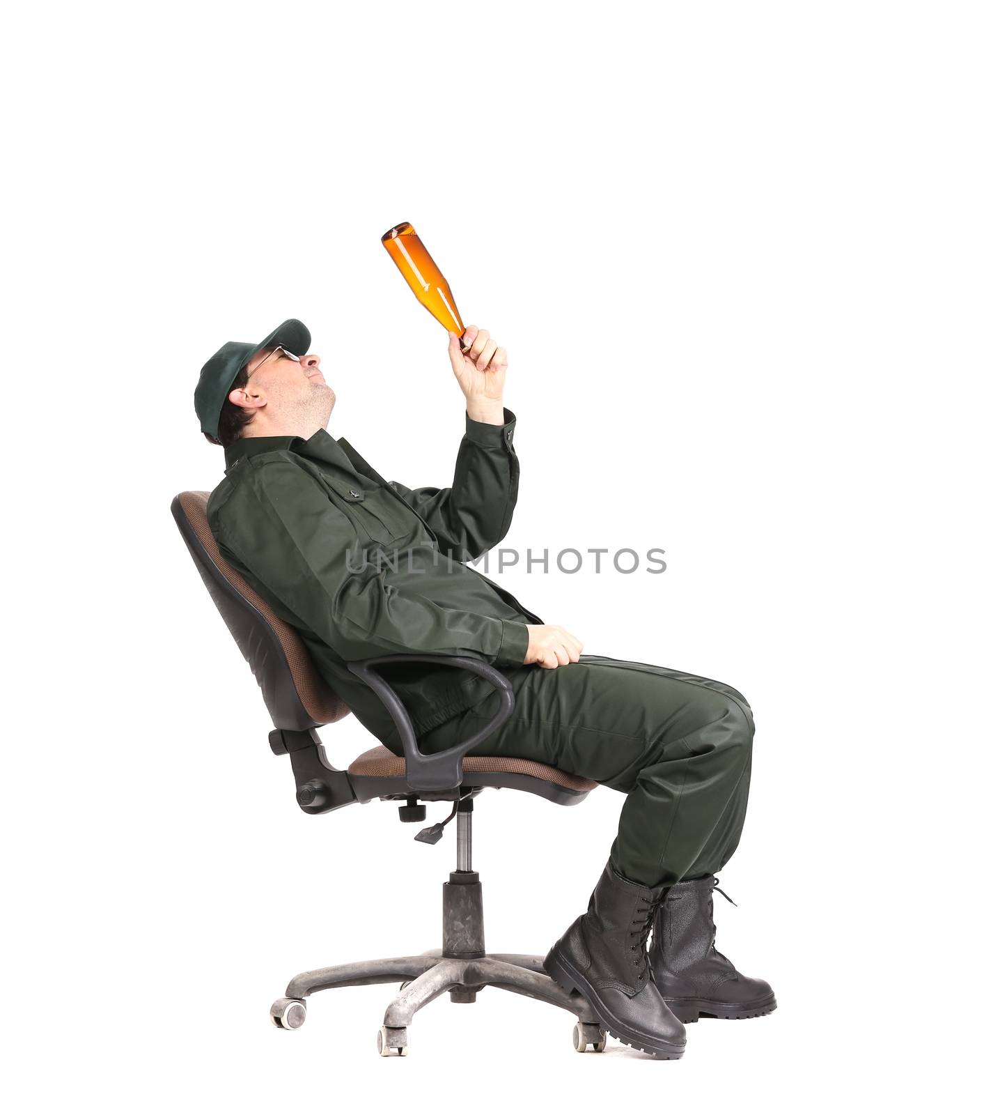 Worker in glasses sitting with beer. Isolated on a white background.