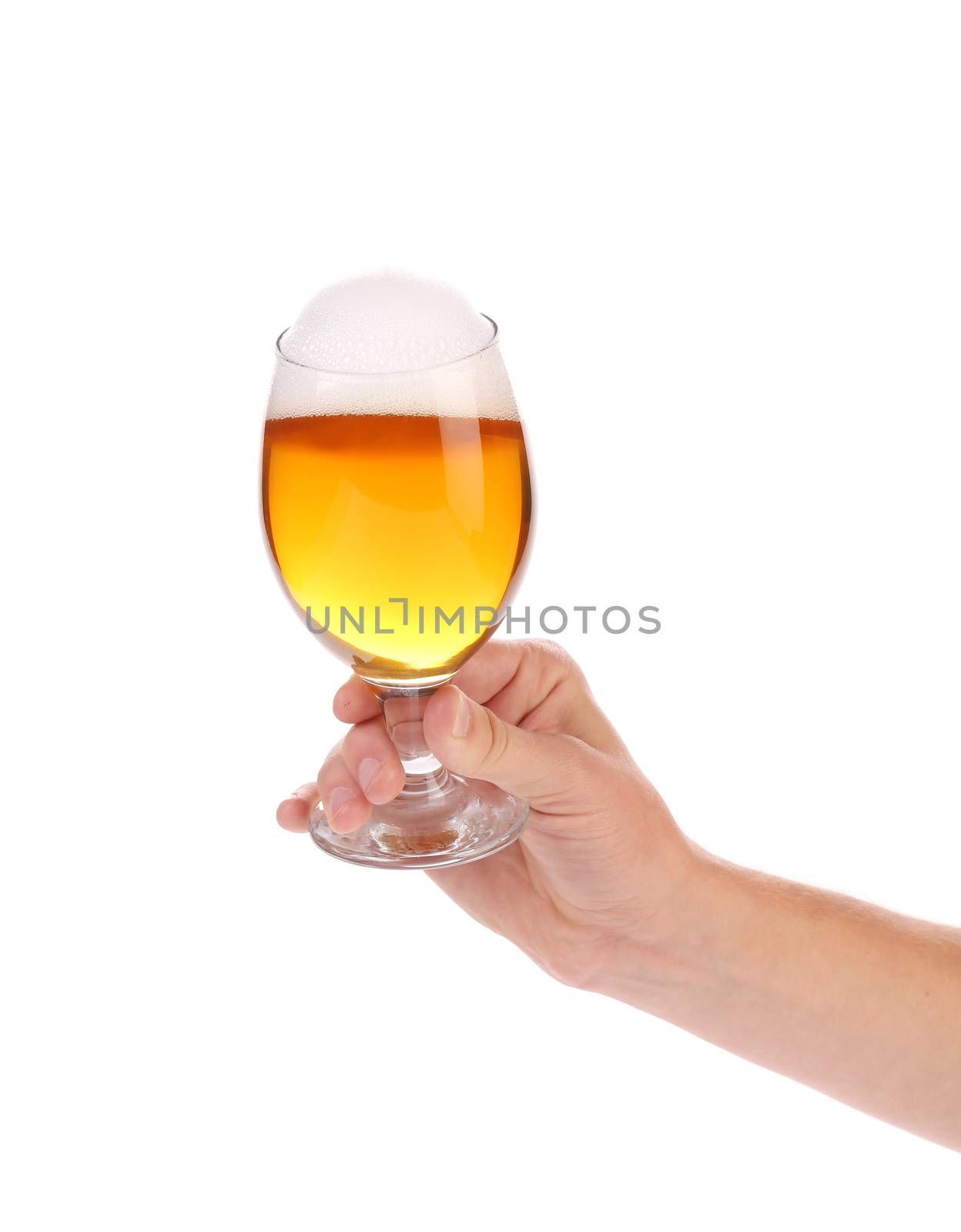Hand with glass of beer. by indigolotos