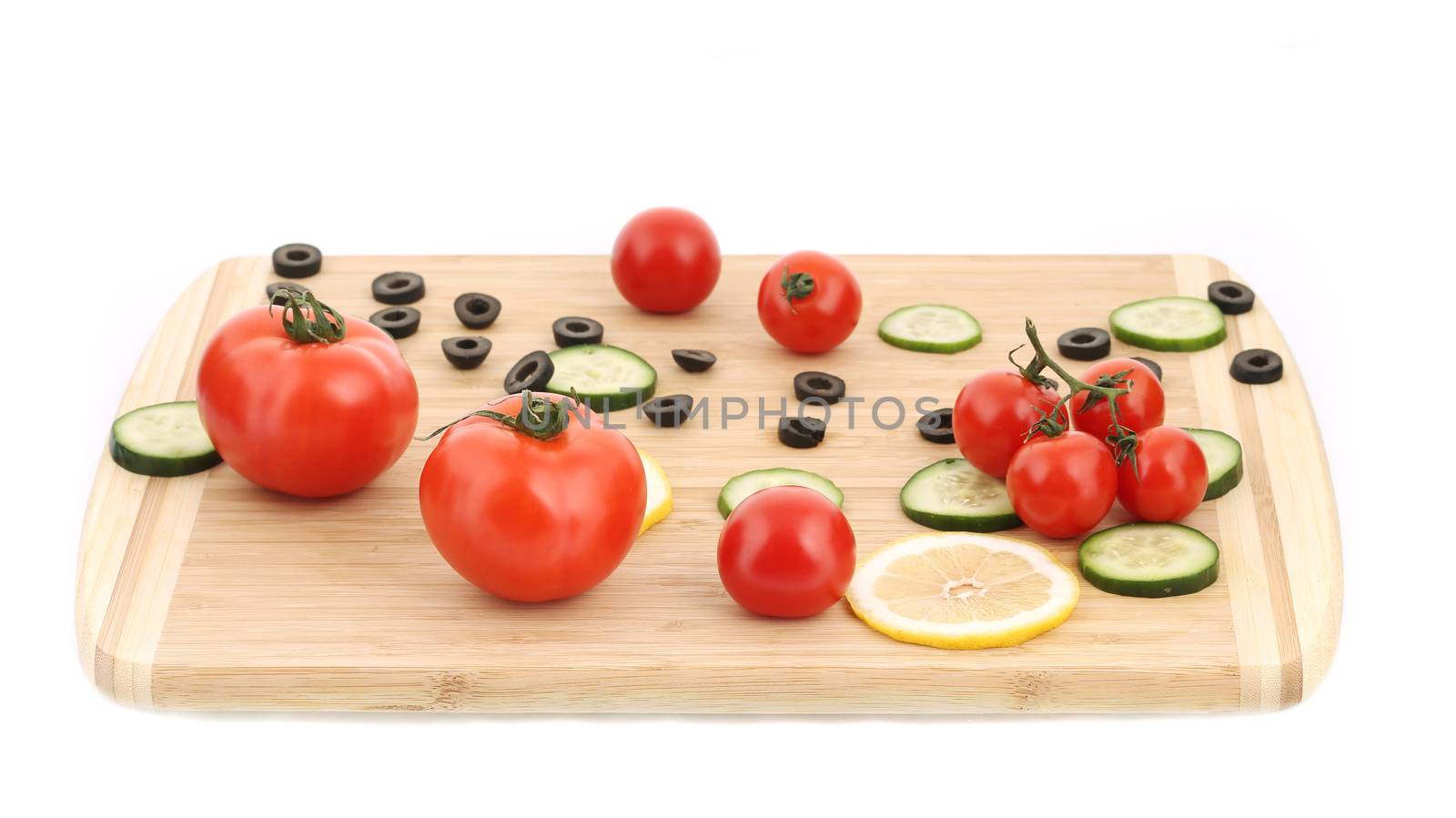 Vegetable composition on cutting board. by indigolotos