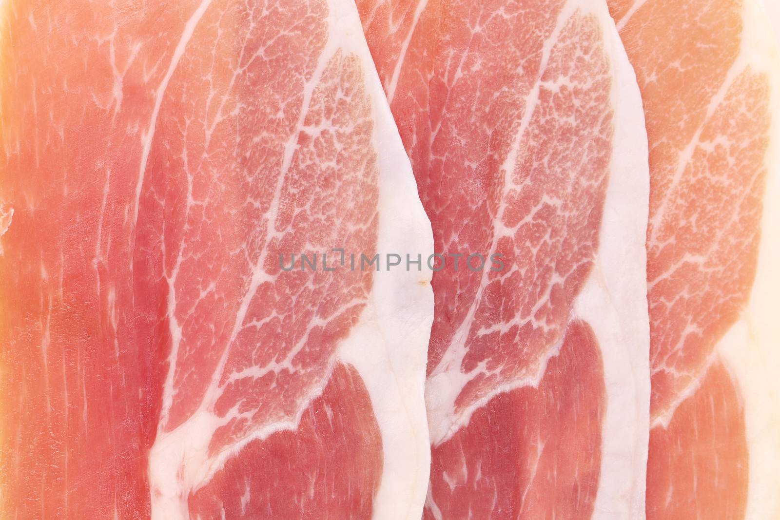 Delicious prosciutto. Isolated on a white background.