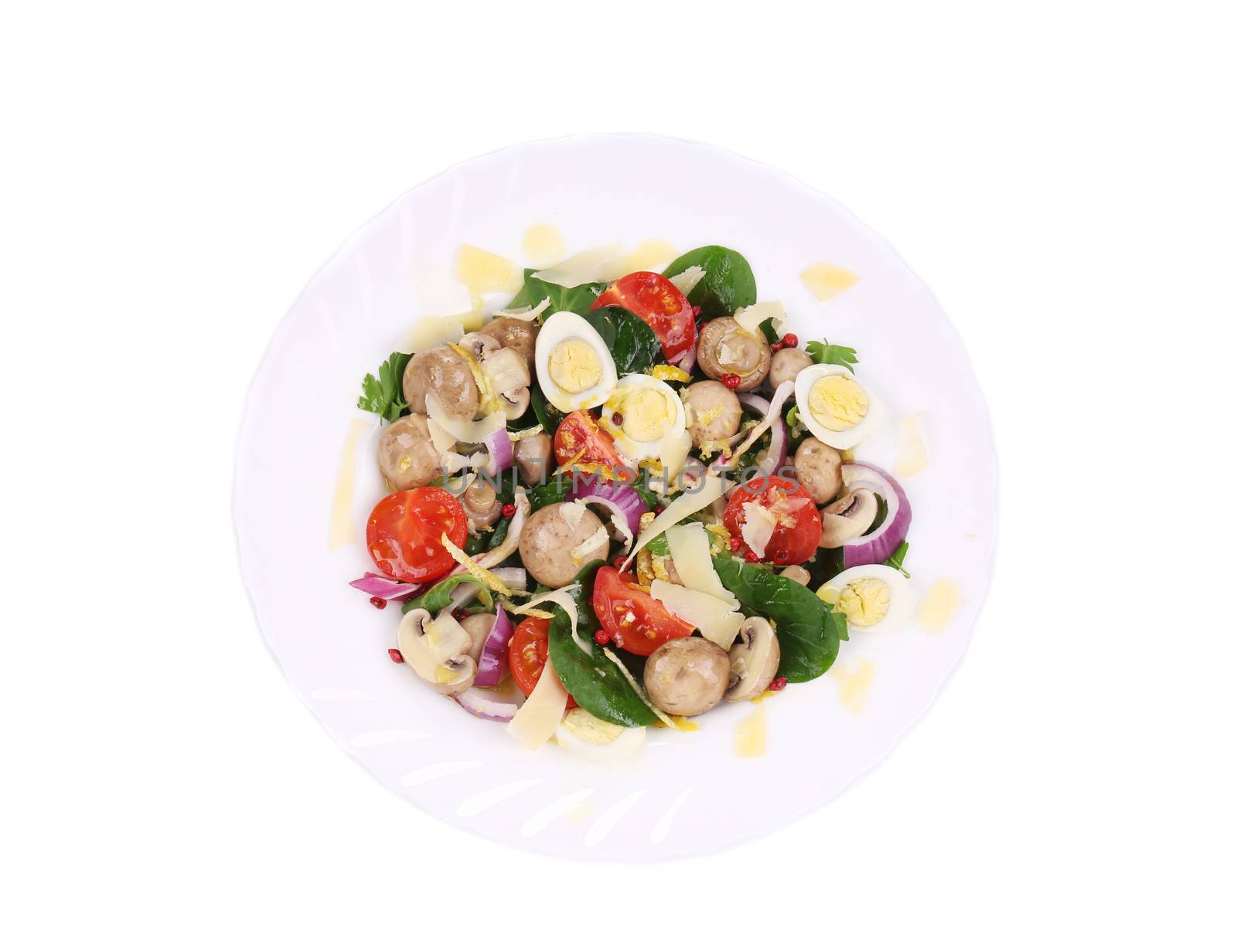 Mushroom salad with tomatoes and quail eggs. Isolated on a white background.