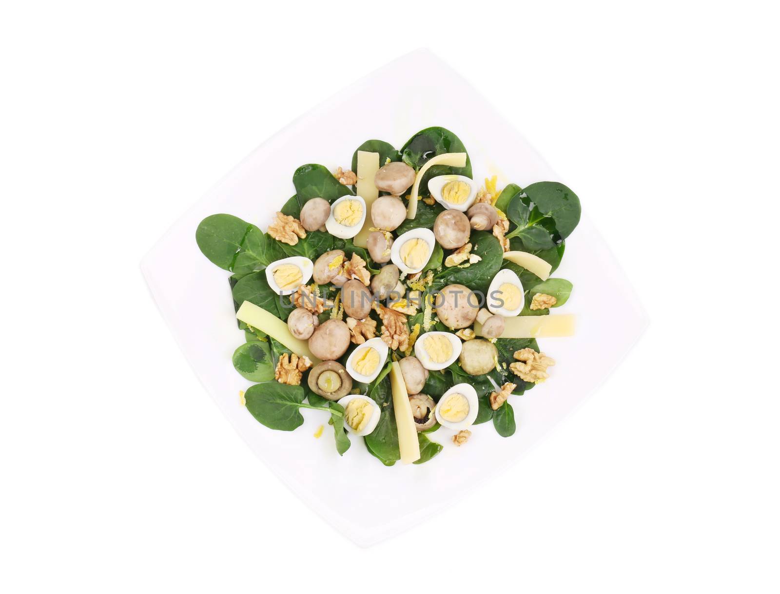 Mushroom salad with walnuts and parmesan. Isolated on a white background.