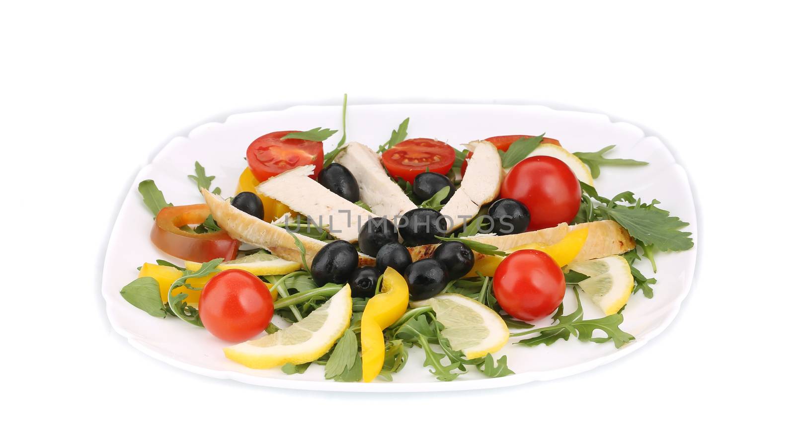 Chicken salad with tomatoes and olives. Isolated on a white background.