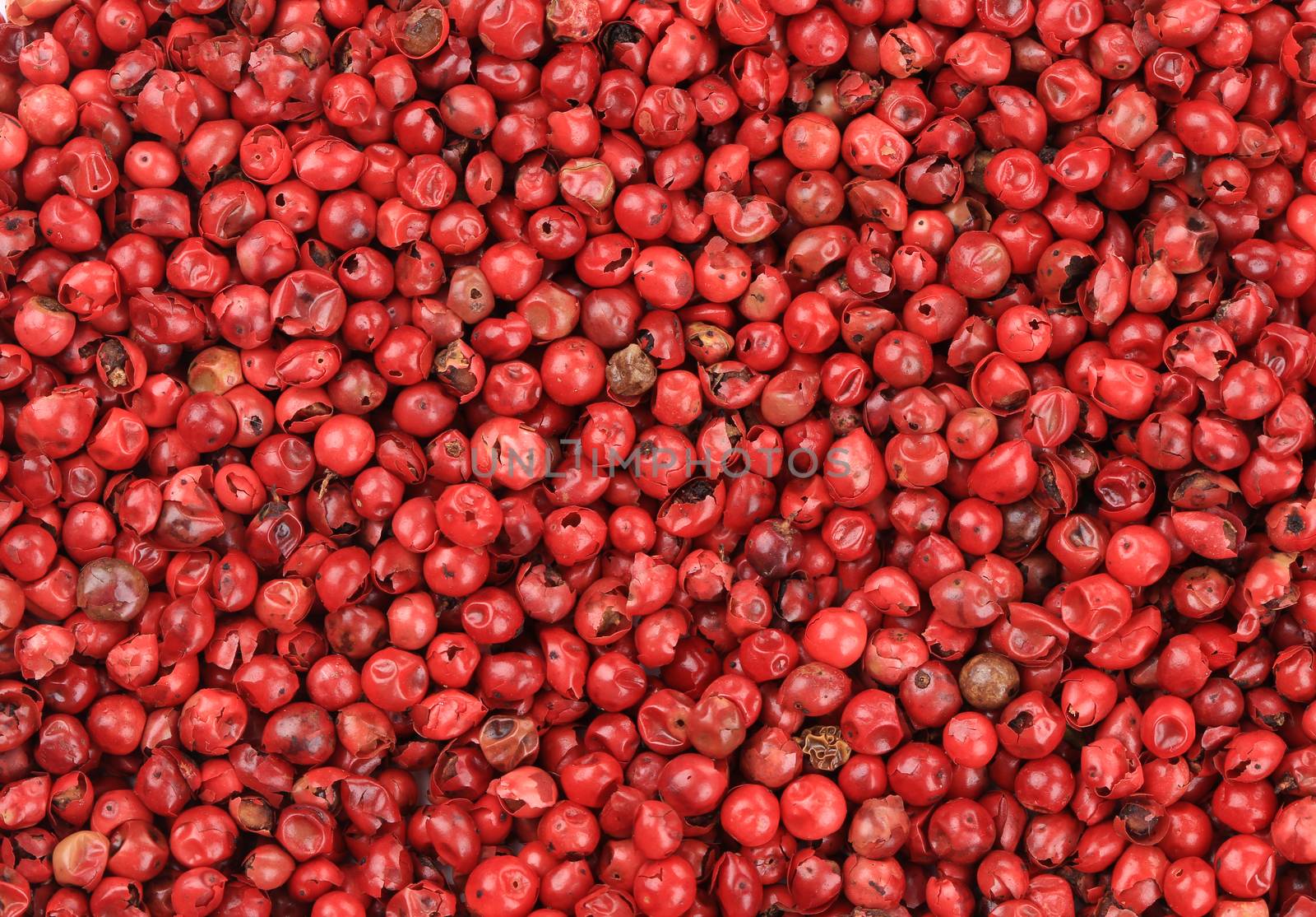 Red hot peppercorn closeup. by indigolotos