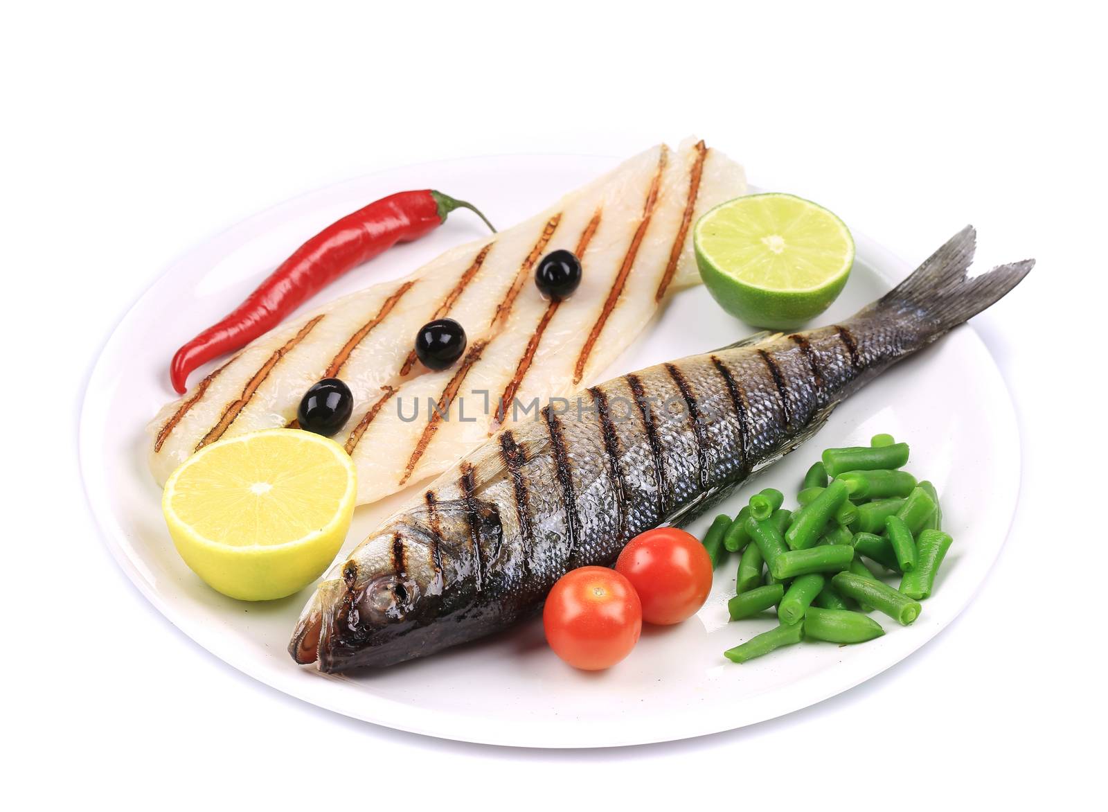 Fish fillet and grilled seabass. Isolated on a white background.