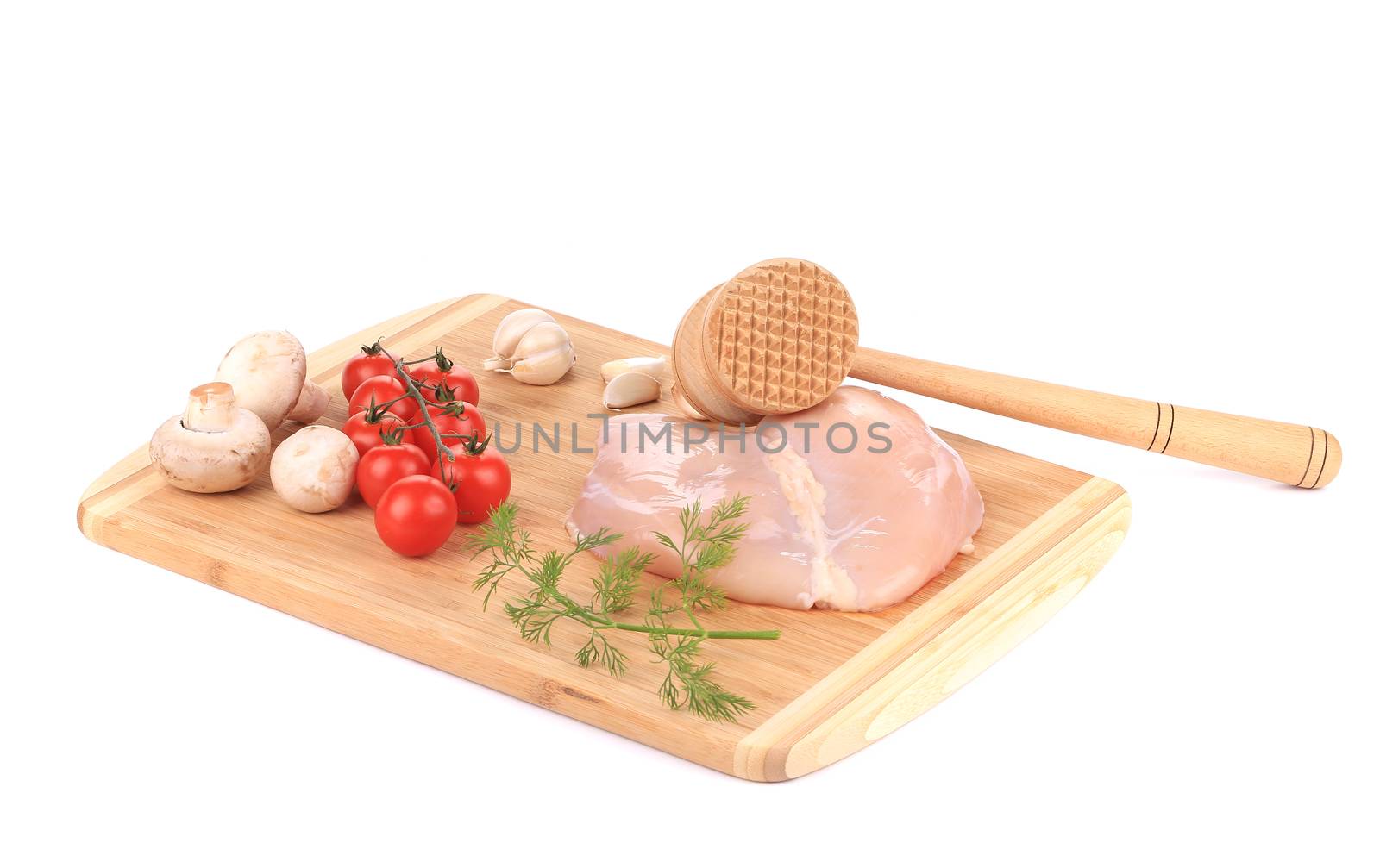 Chicken fillet and meat mallet. Isolated on a white background.