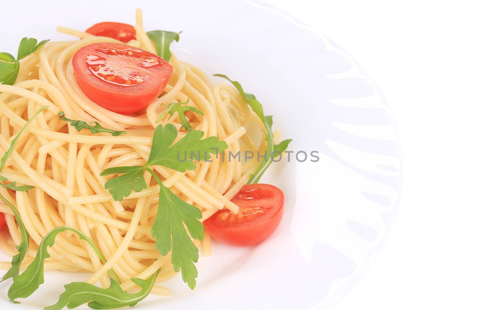 Delicious spaghetti with herbs. Isolated on a white background.