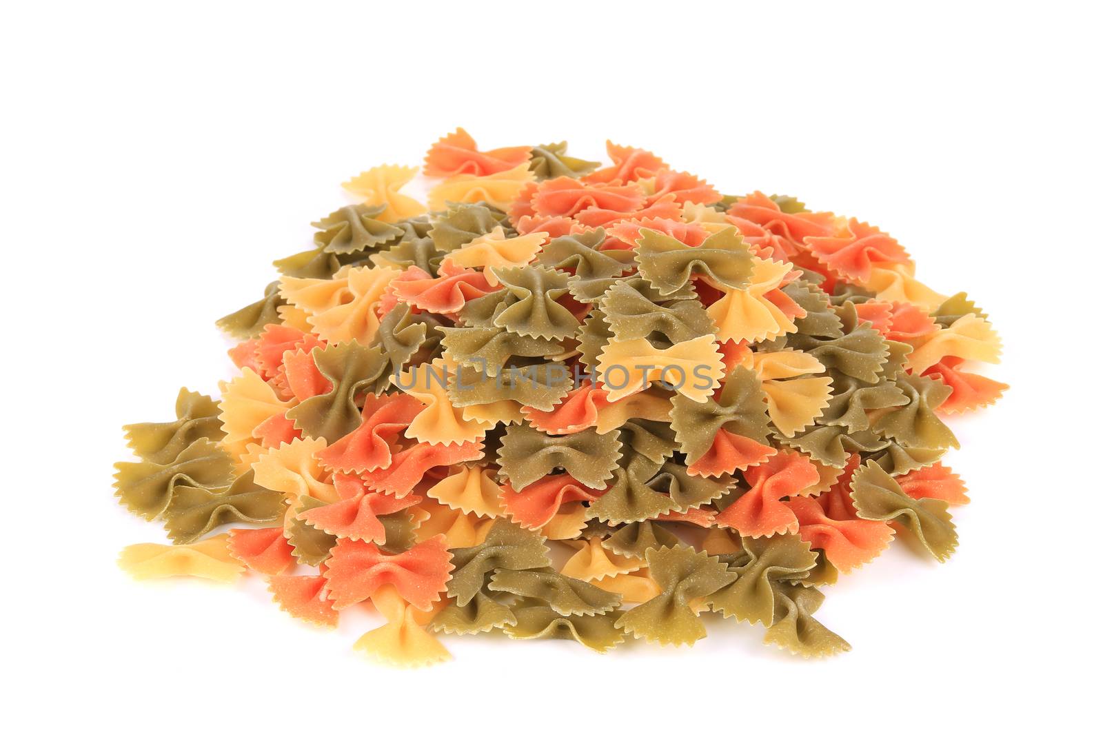 Heap of italian pasta farfalle. by indigolotos