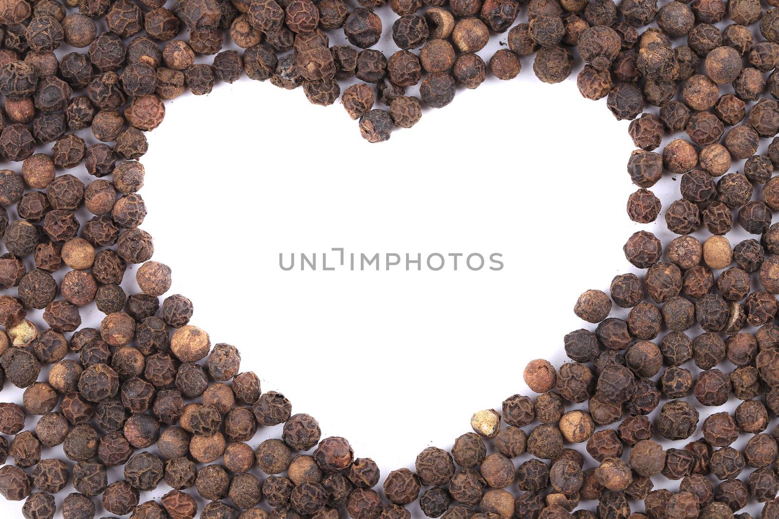 Black peppercorn in shape of heart. by indigolotos