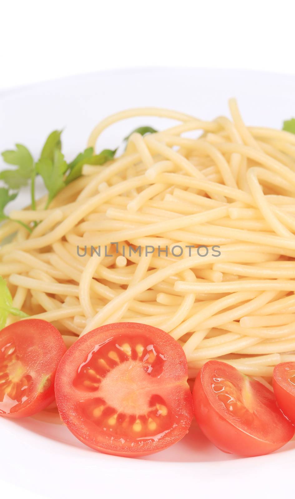 Delicious spaghetti with herbs. Isolated on a white background.