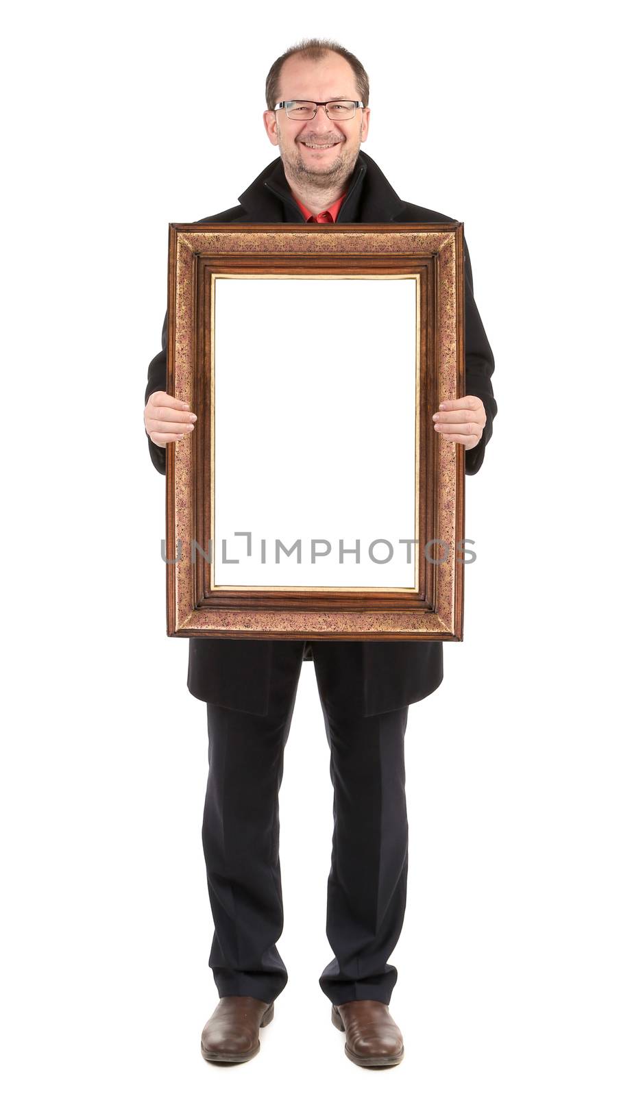 Smiling man holding wooden frame. by indigolotos