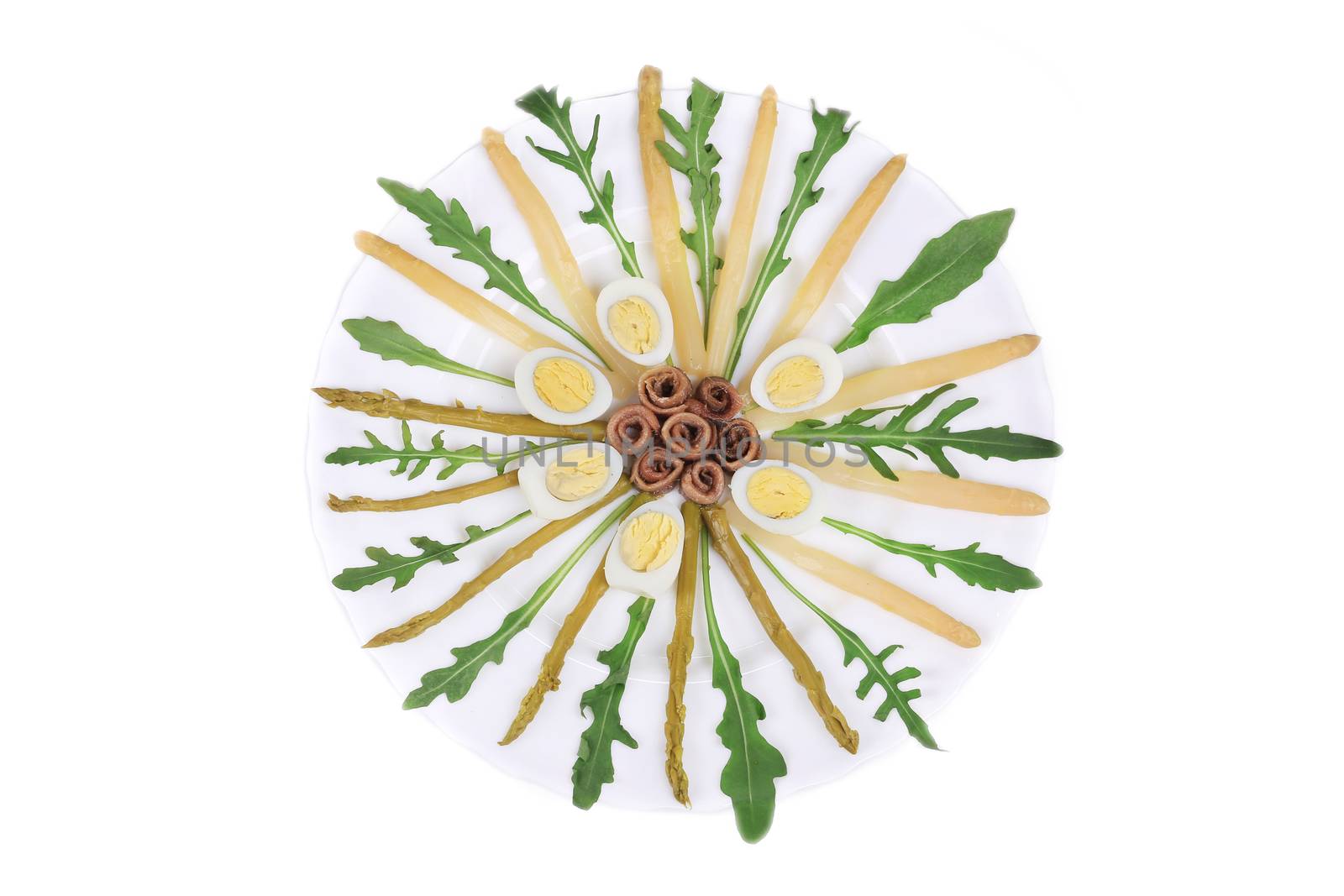 Asparagus salad with anchovies Isolated on a white background.
