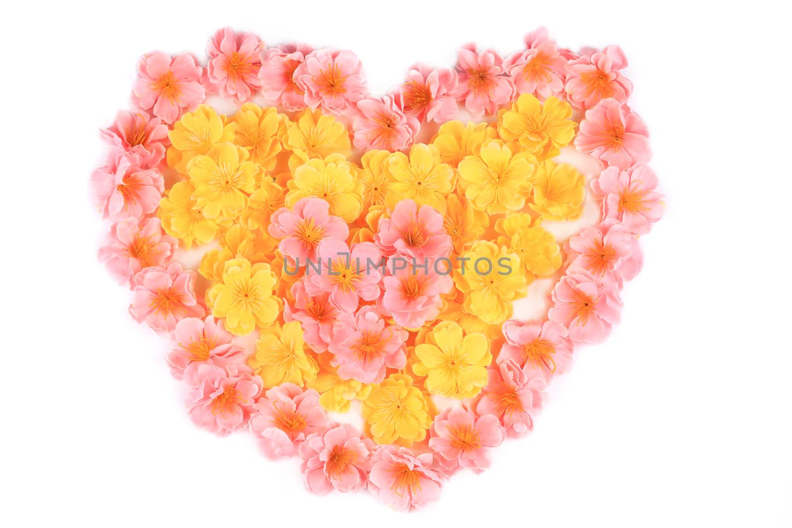 Artificial flowers in shape of heart. Isolated on a white background.