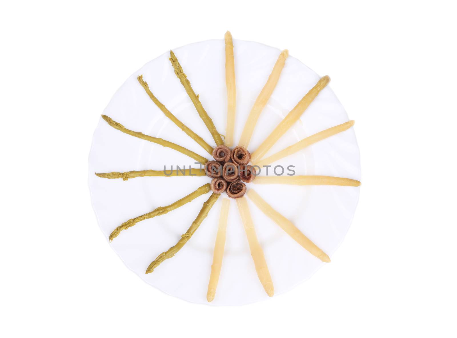 Asparagus and anchovies. Isolated on a white background.