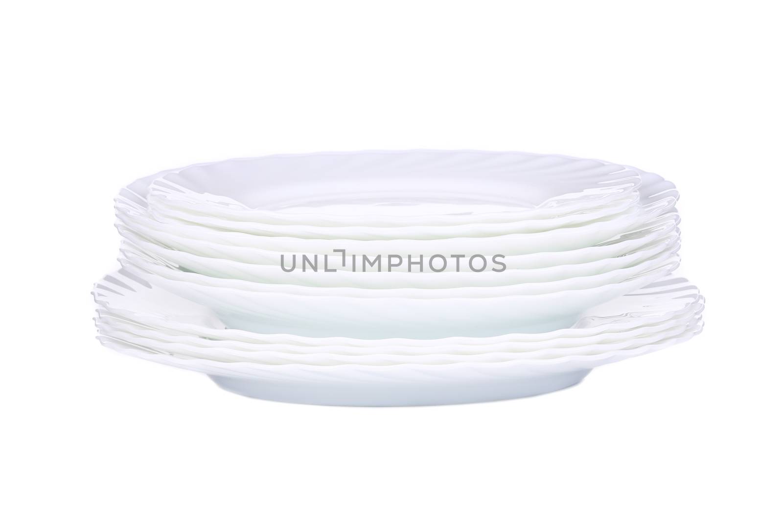 Stack of new clean white plates. Isolated on a white background.