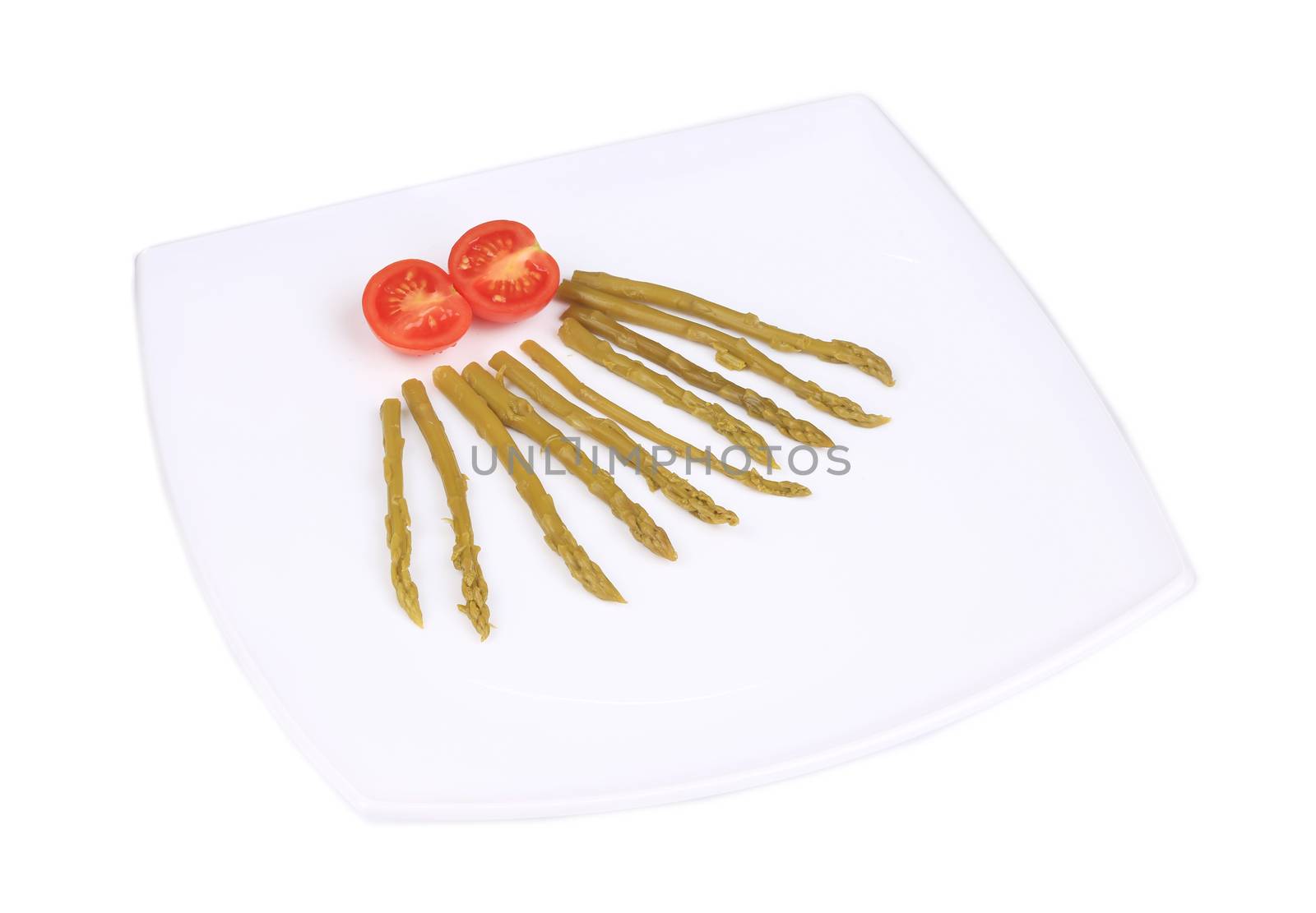 Canned green asparagus and tomatoes. Isolated on a white background.