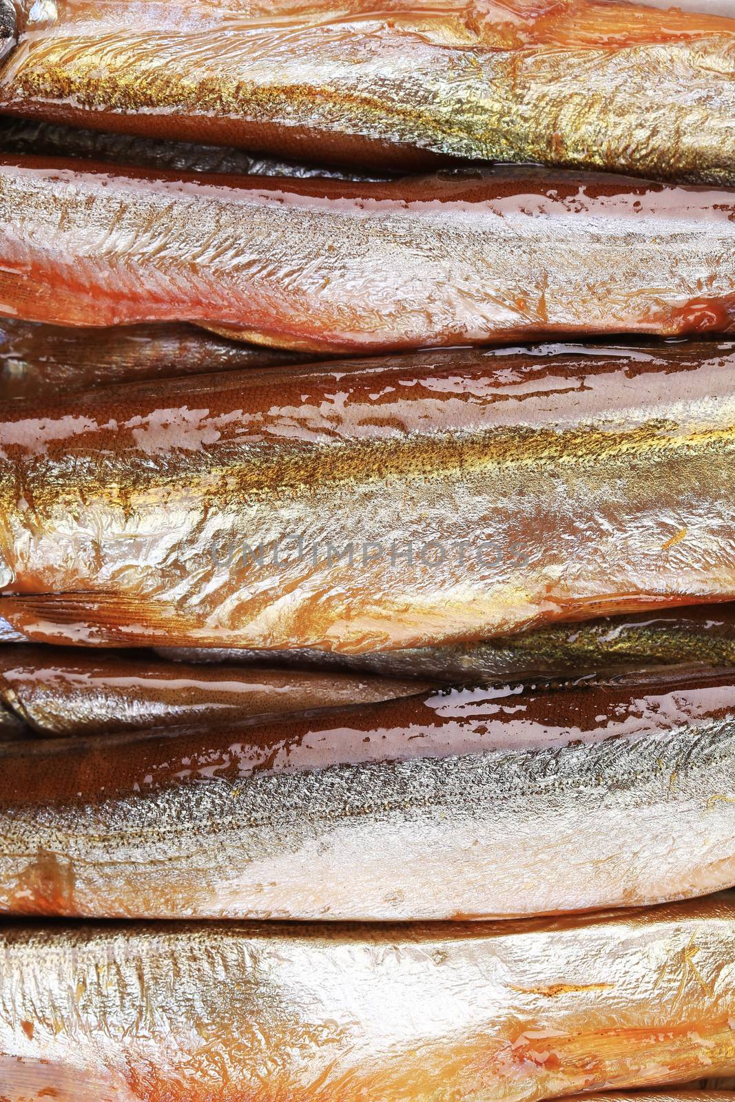 Tasty smoked fish closeup for a background.