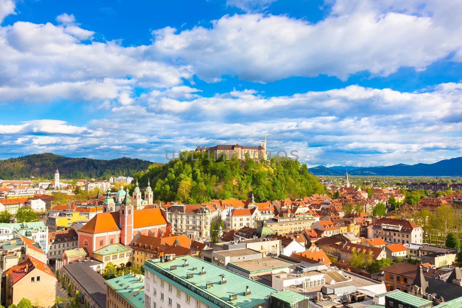 Panorama of the vibrant Slovenian capital Ljubljana in afternoon sun.