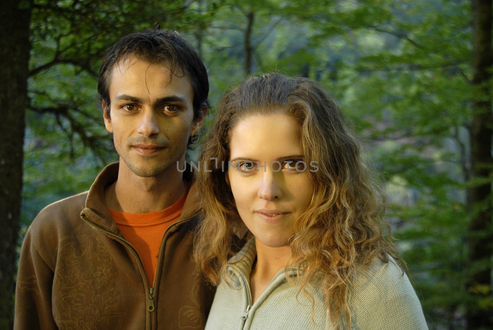 young fashion couple portrait at the forest