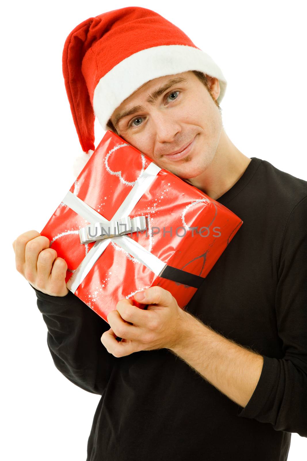 young man with santa hat holding a gift, isolated