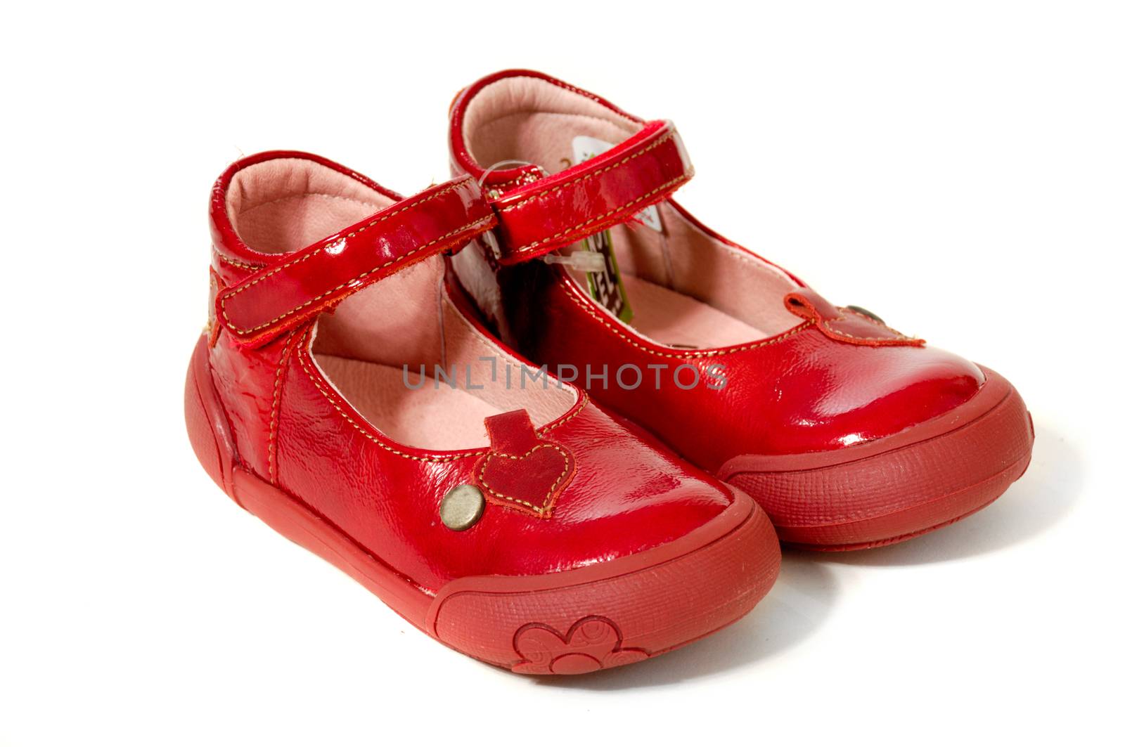 A pair of red shoes isolated on a clean white background.