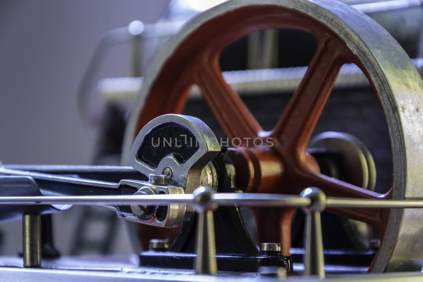 Close up of the flywheel of a steam engine