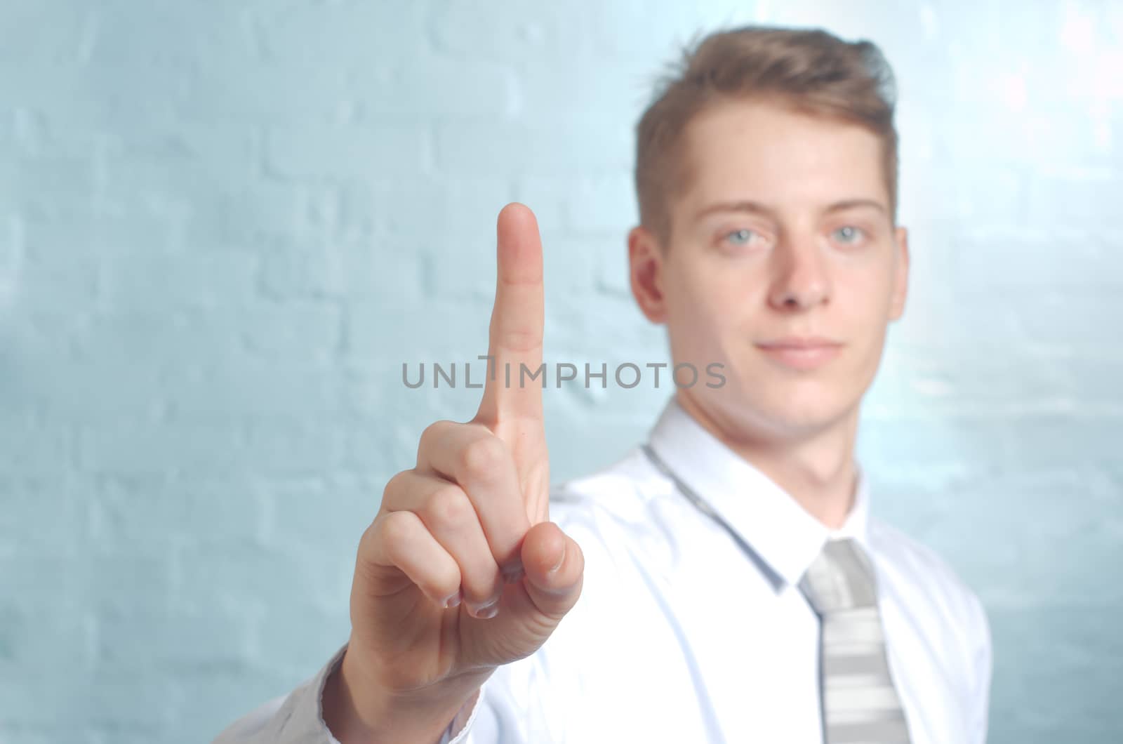 Businessman pushing imaginary button one finger - insert own concept