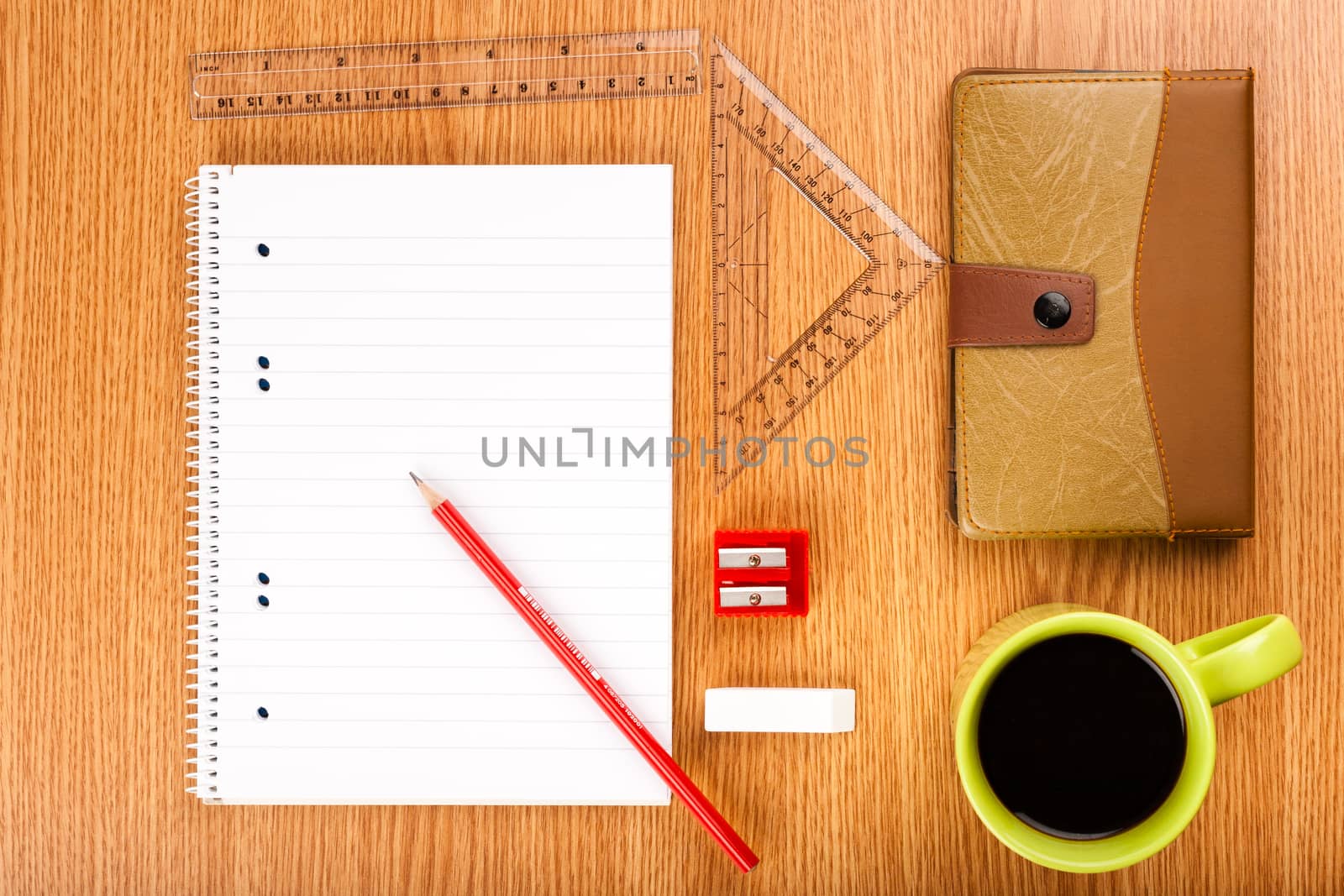 workspace table shot from above with organizer rulers paper and pencil