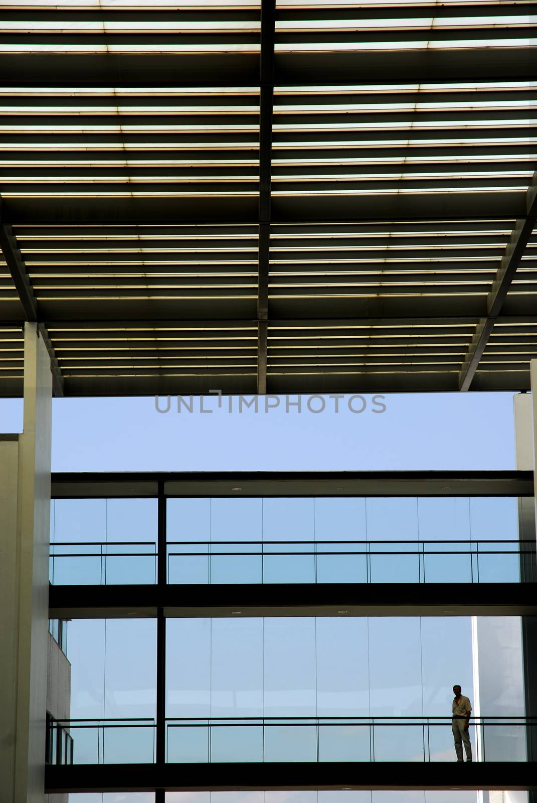 man inside the modern building in silhouette