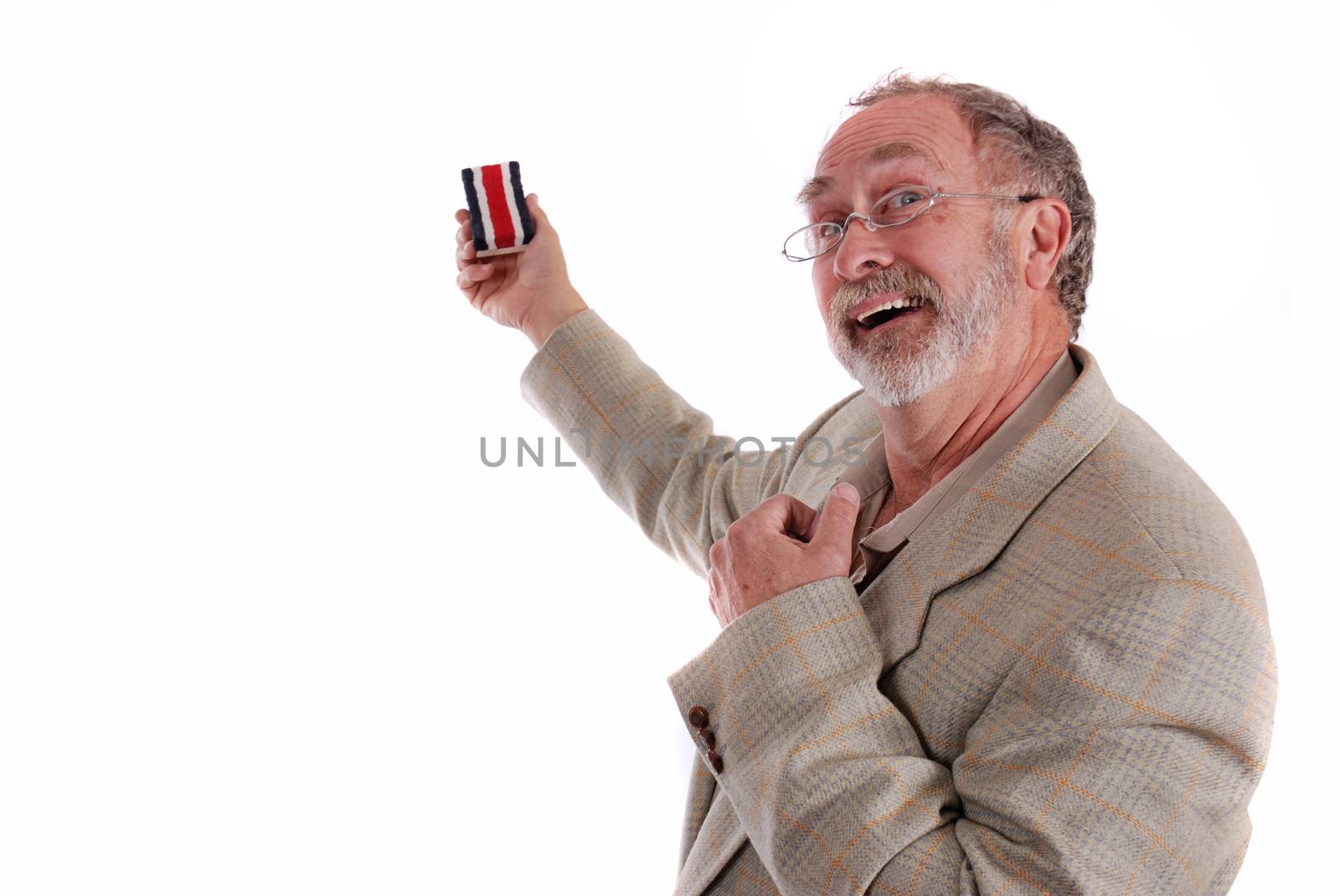 A professor gesturing with his chalk board eraser and white board