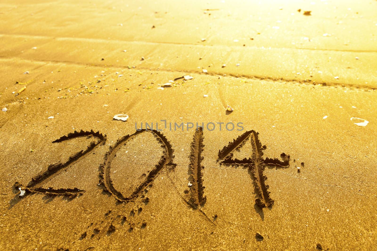 New year 2014 digits on ocean beach sand by kawing921