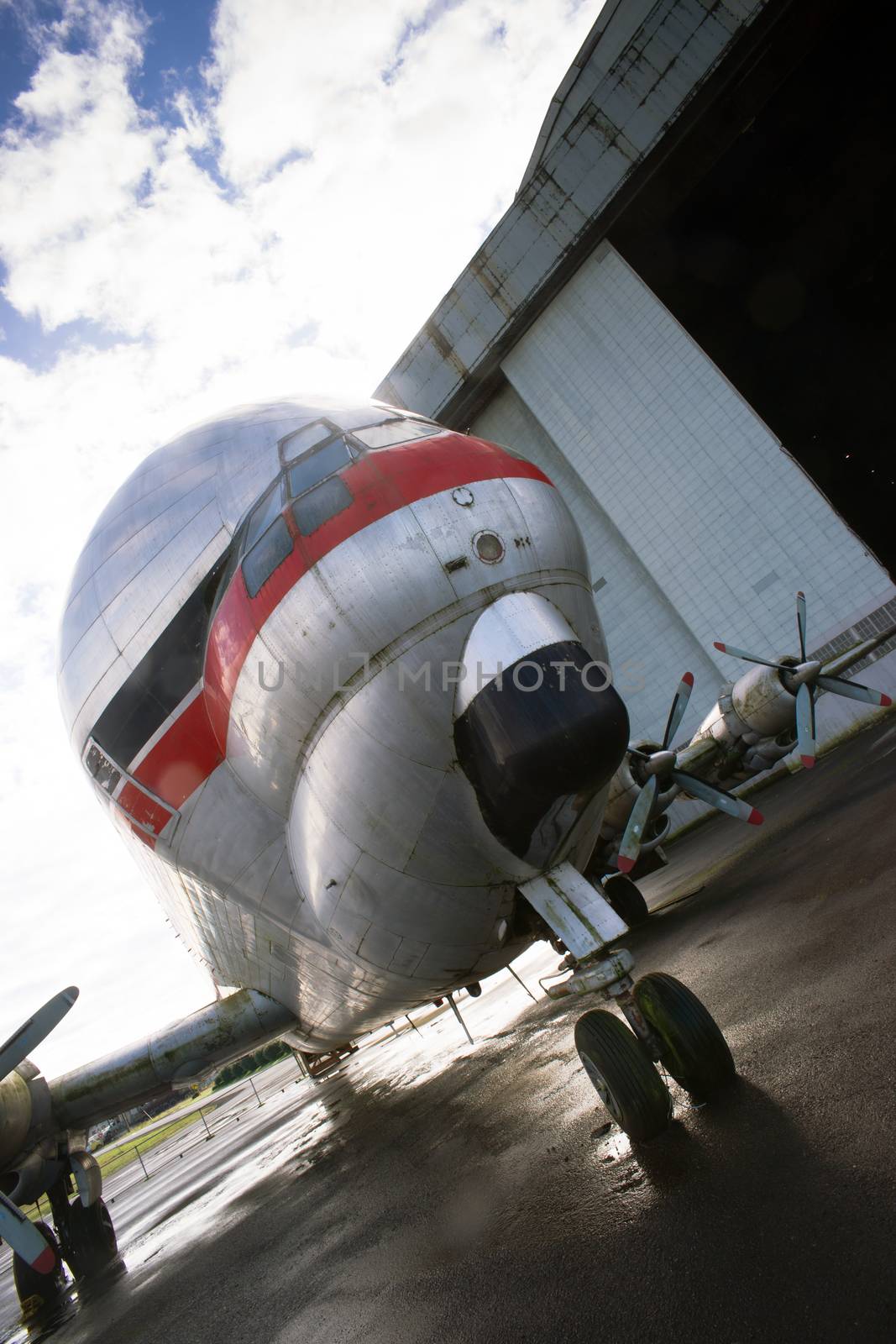 An unusual vintage aiplane rolls out of airport hangar