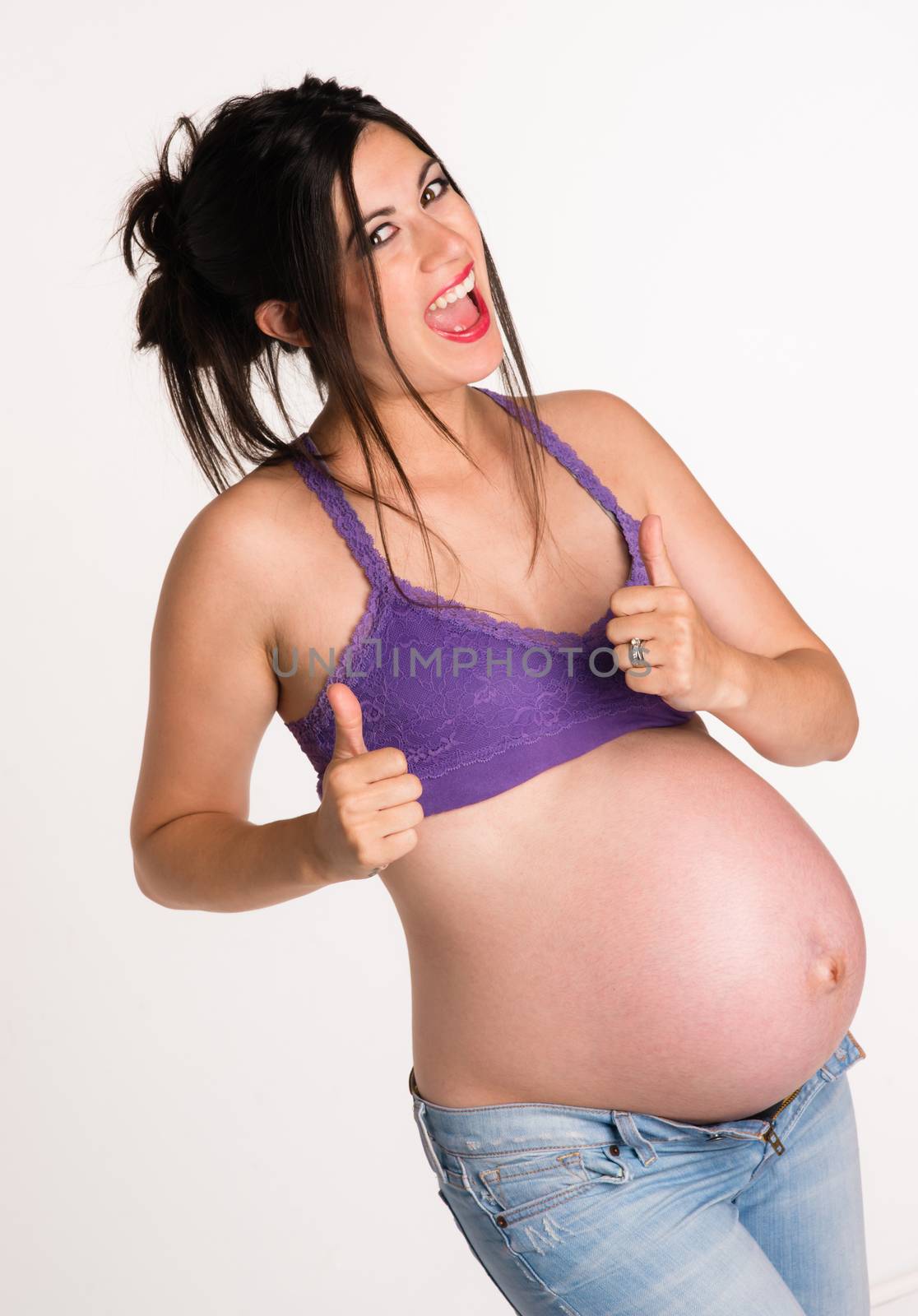 Attractive Pregnant Woman Gives A-OK Hand Signal Thumbs Up by ChrisBoswell