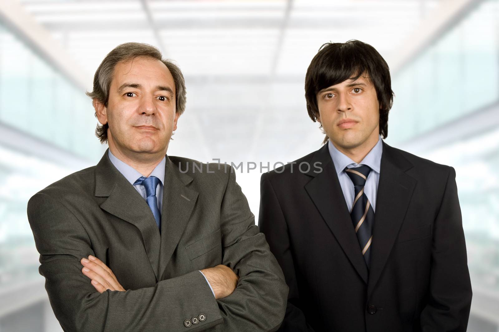 two young business men portrait, at the office