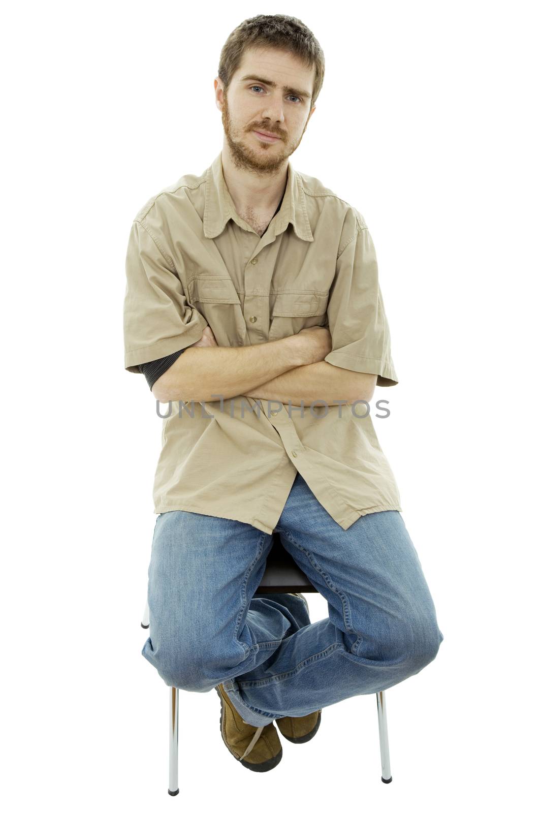 young bored casual man on a chair, isolated on white