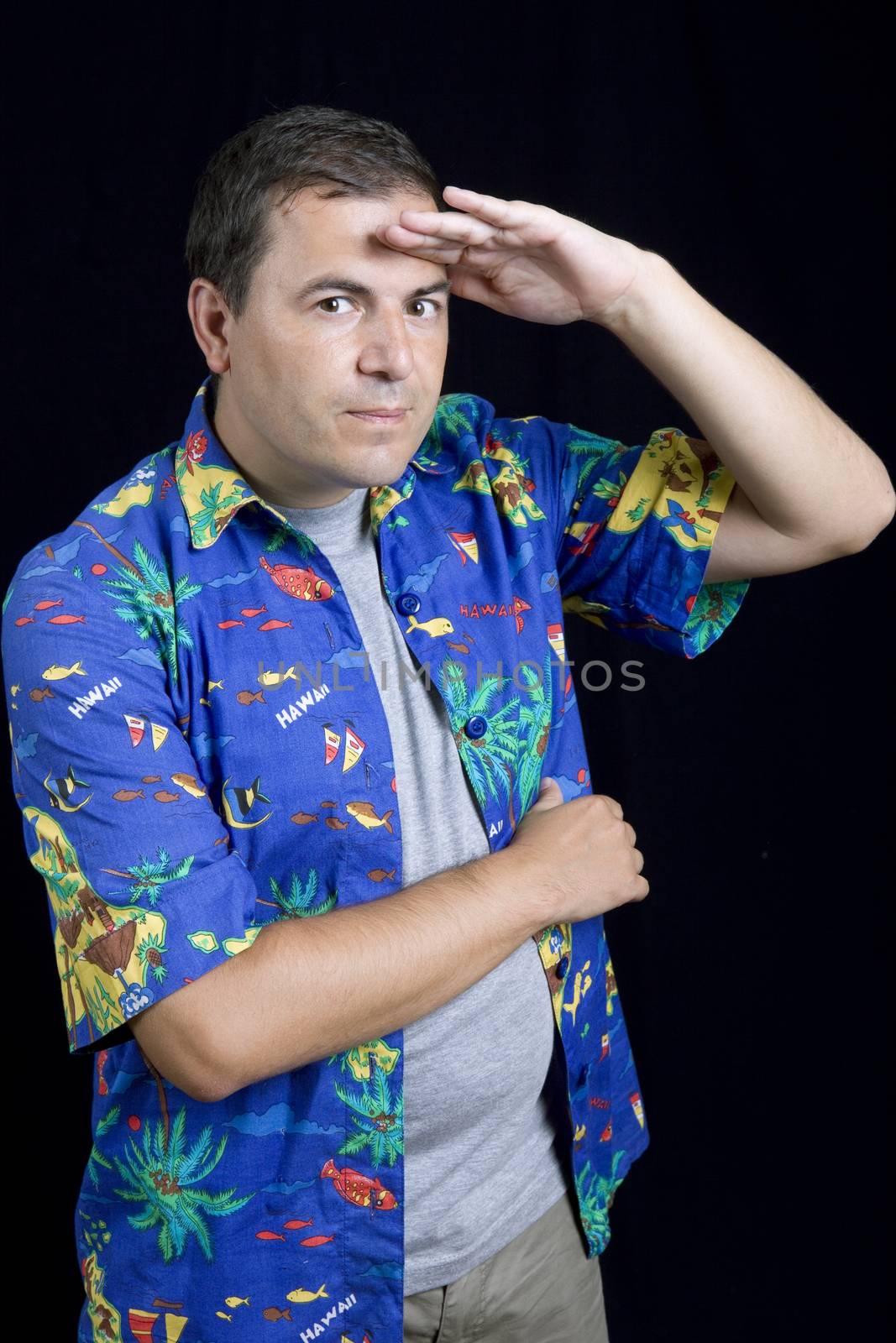 young casual man portrait on a black background