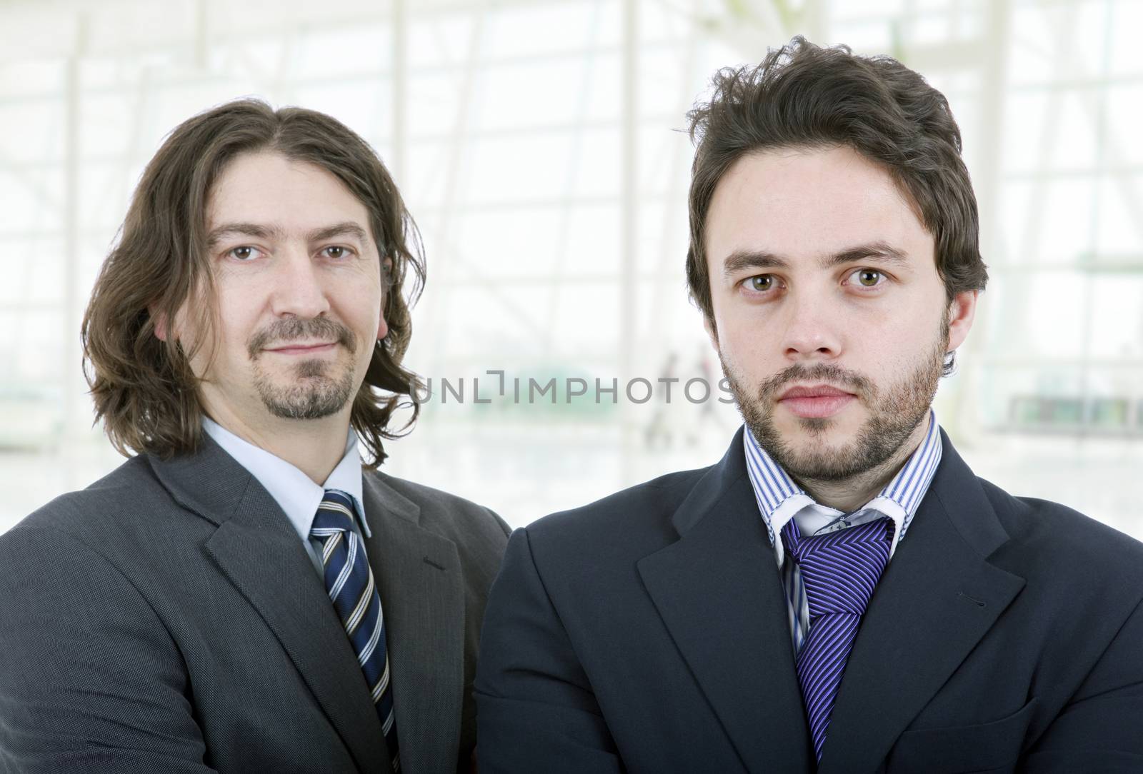 two young business men portrait at the office