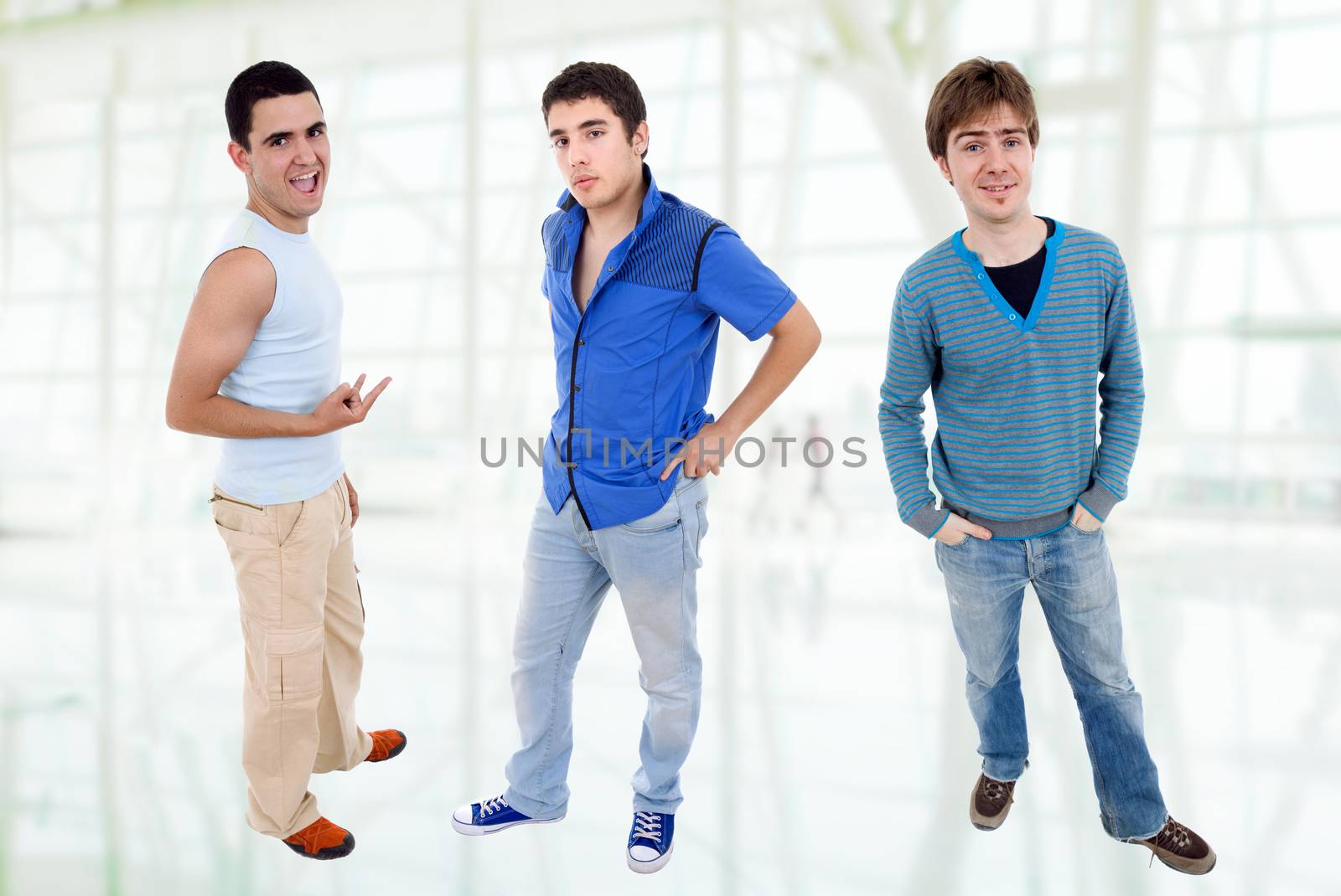 three young casual men standing