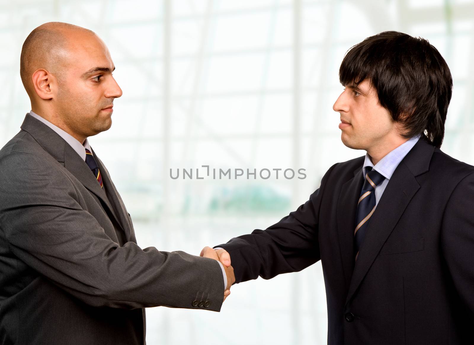 businessmen shaking hands at the office