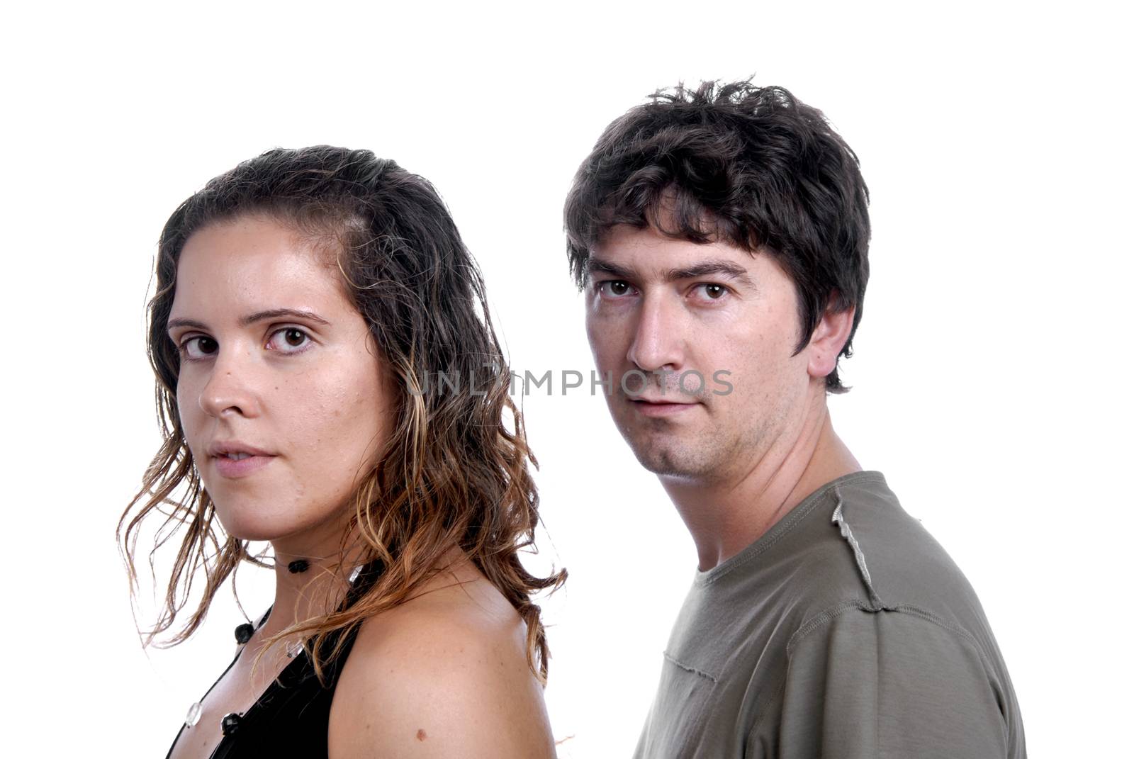 young casual couple portrait in studio shot