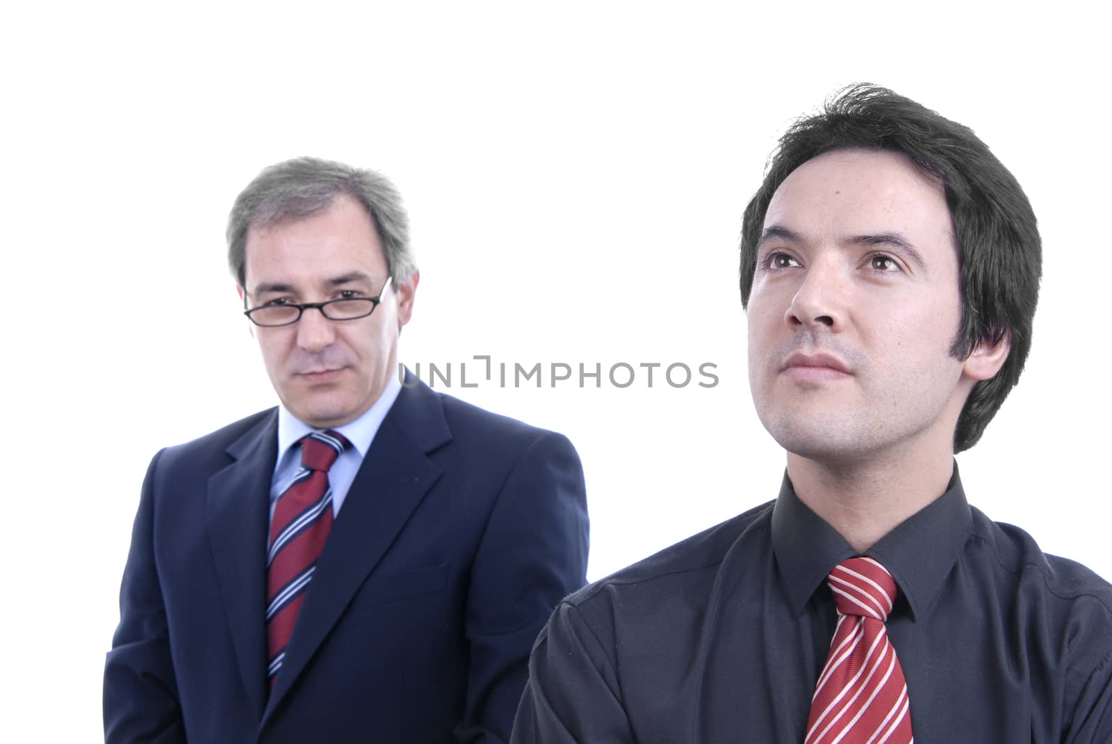 two business men portrait on white. focus on the right man