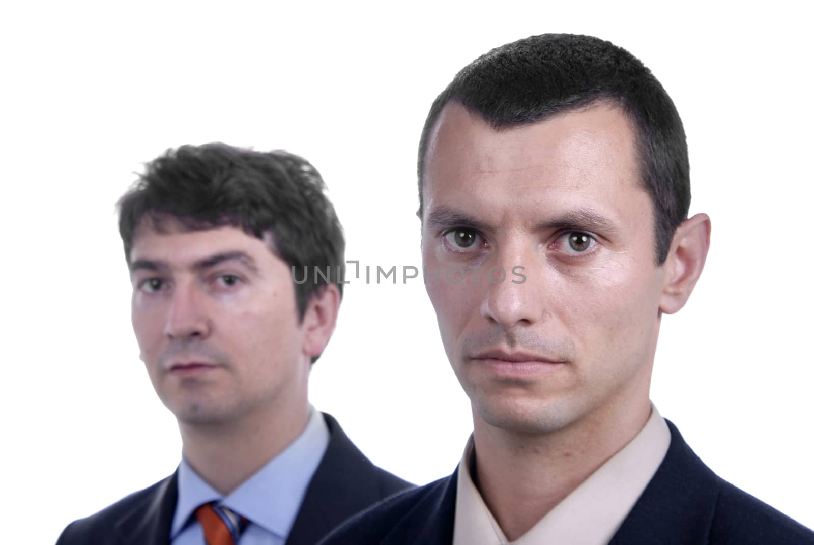 two young business men portrait on white. focus on the right man