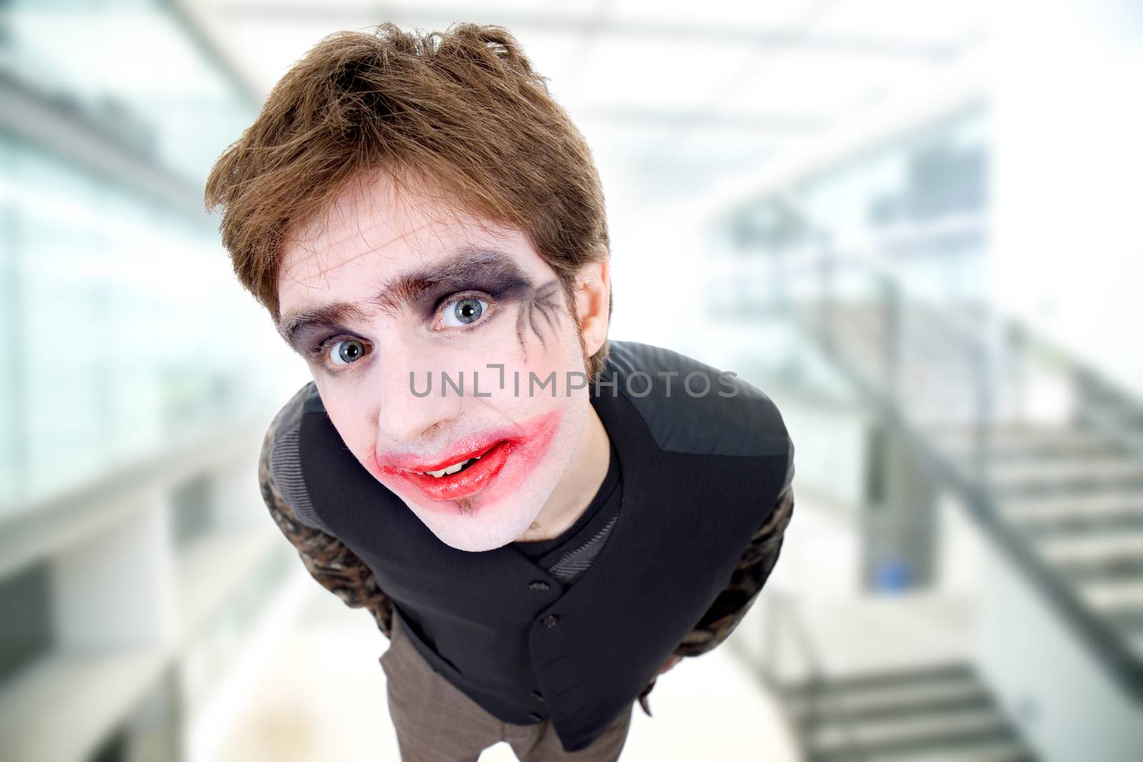 crazy young man dressed as joker