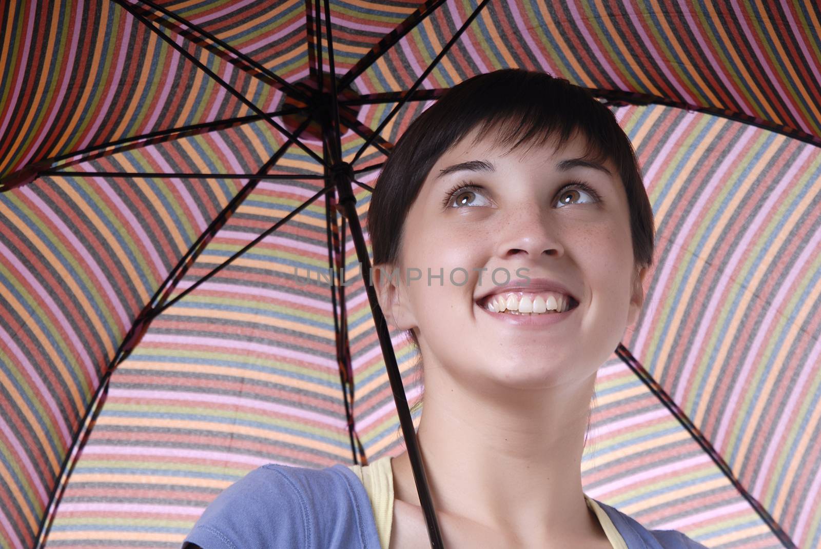 young brunette girl with umbrella in colors