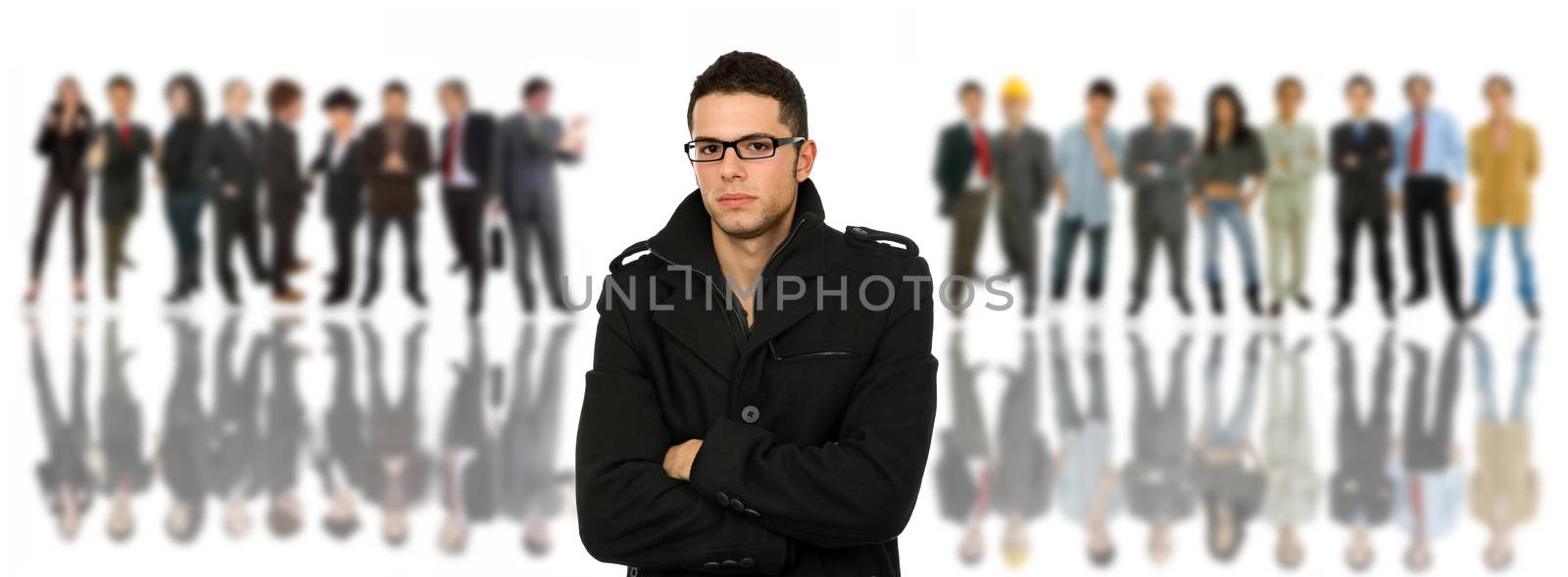 young casual man in front of a group of people